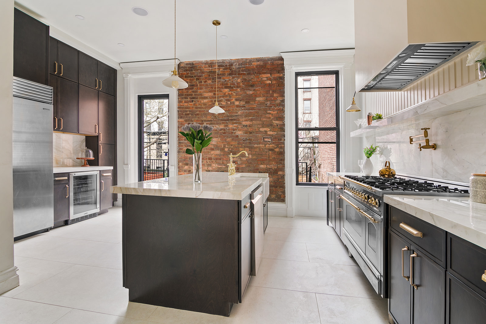 a kitchen with stainless steel appliances granite countertop a stove and a refrigerator