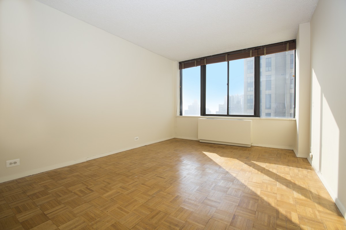 a view of an empty room with a window