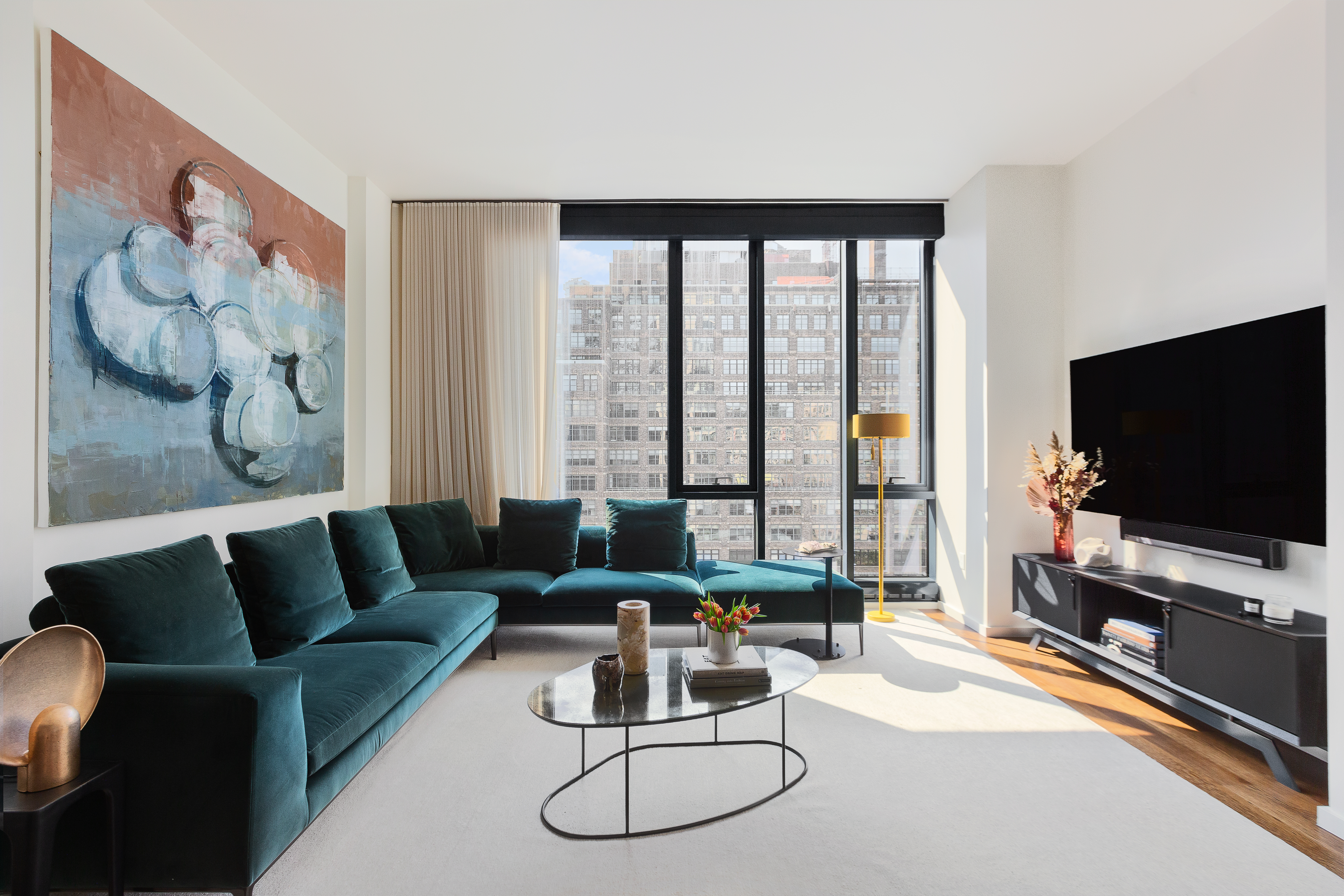 a living room with furniture and a flat screen tv