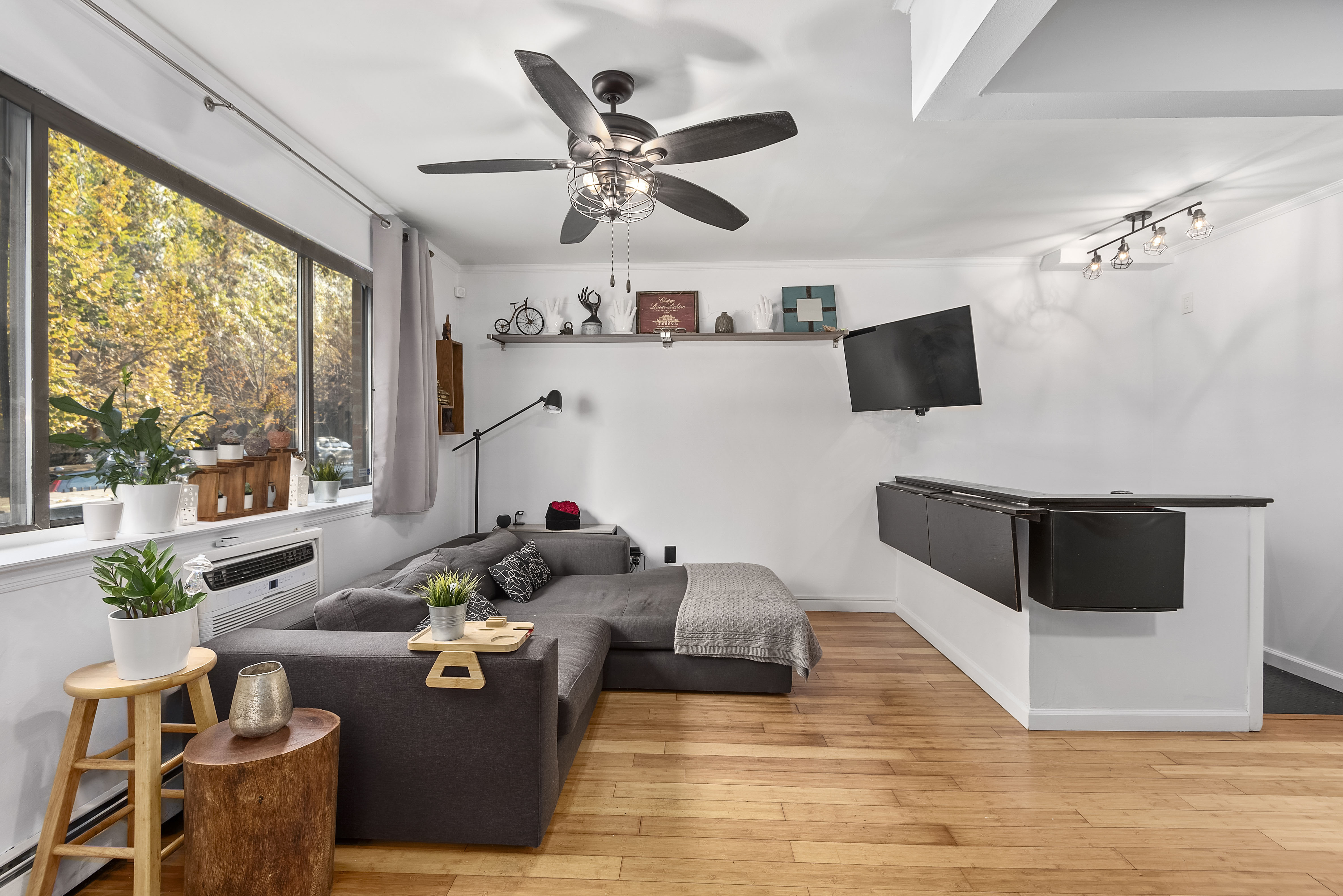 a living room with furniture and a large window