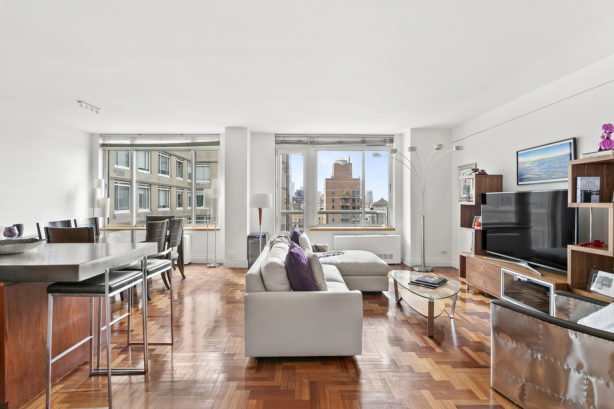 a living room with furniture and a flat screen tv