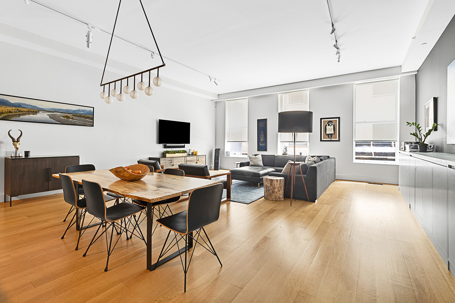 a view of a livingroom with furniture and a flat screen tv