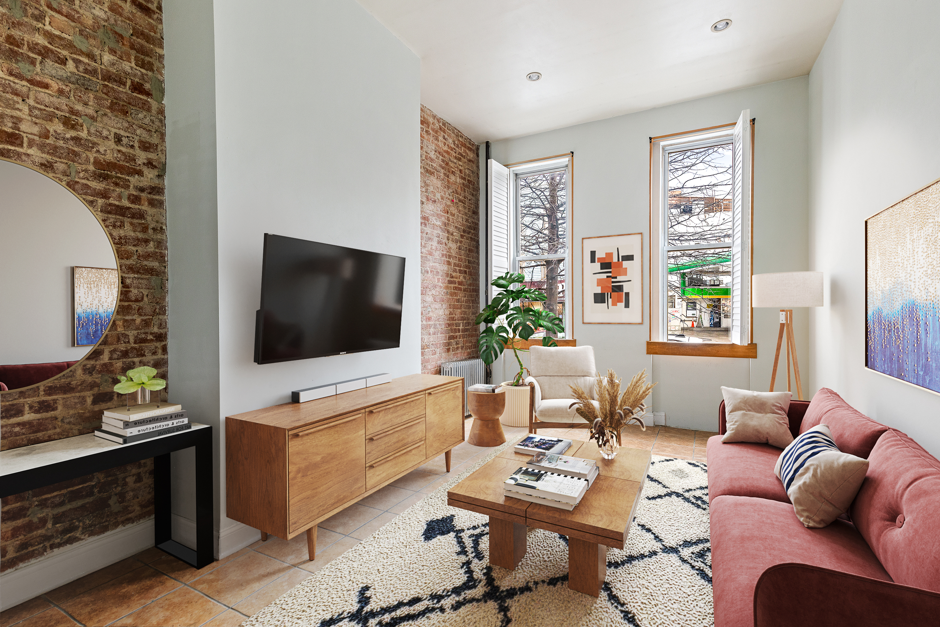 a living room with furniture and a flat screen tv