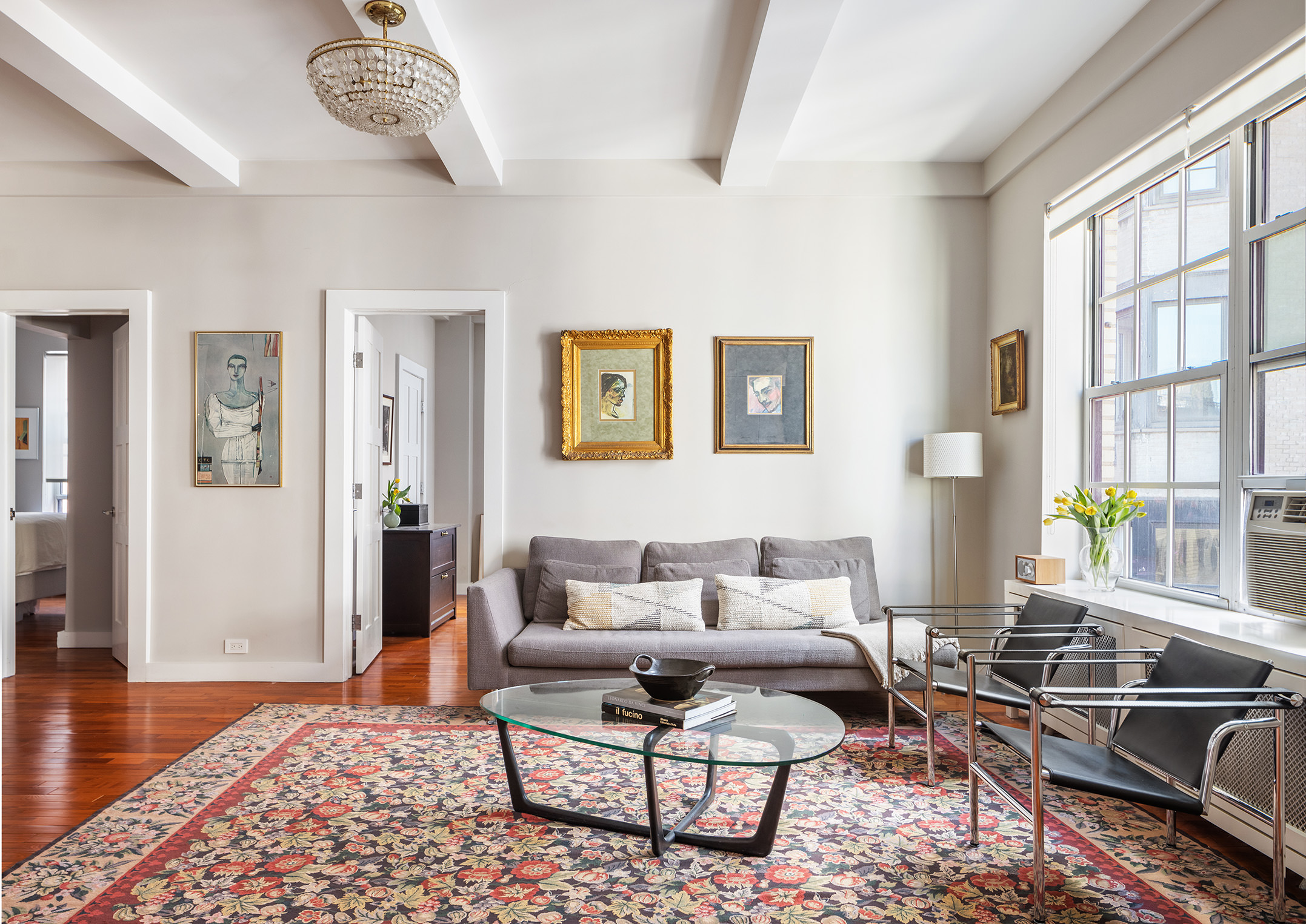 a living room with furniture or couch and two windows