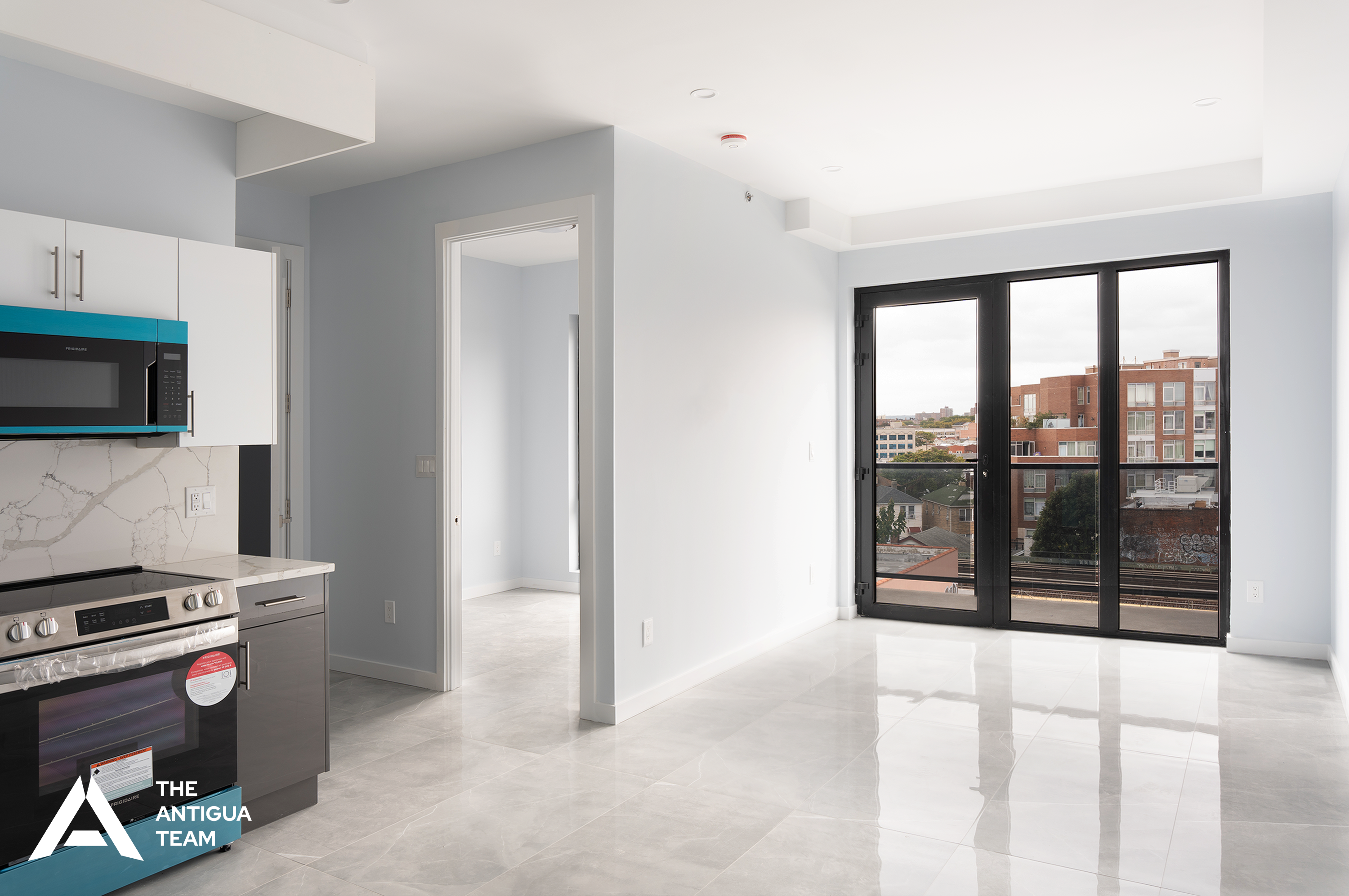 a living room with furniture a flat screen tv and a window