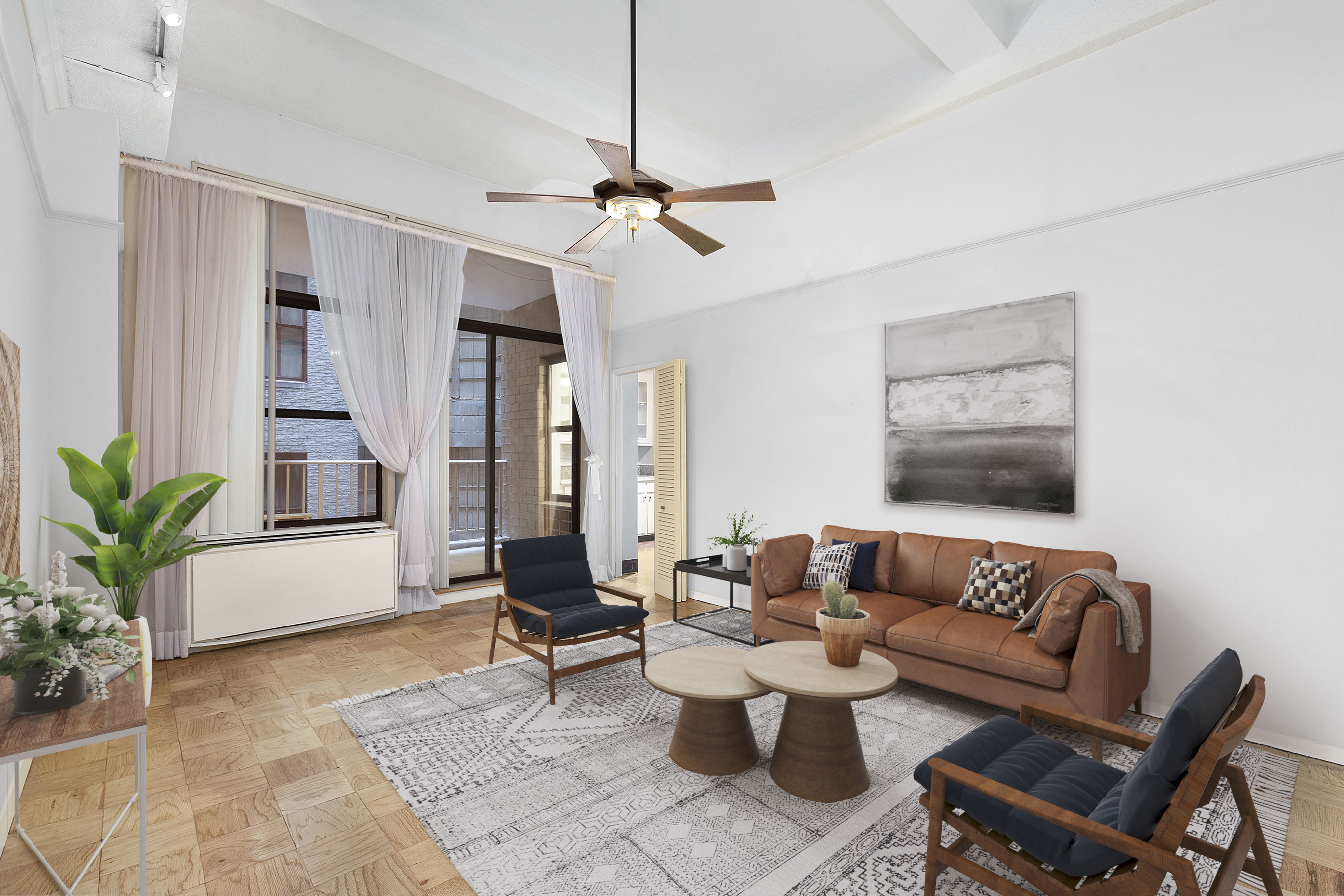 a living room with furniture and wooden floor