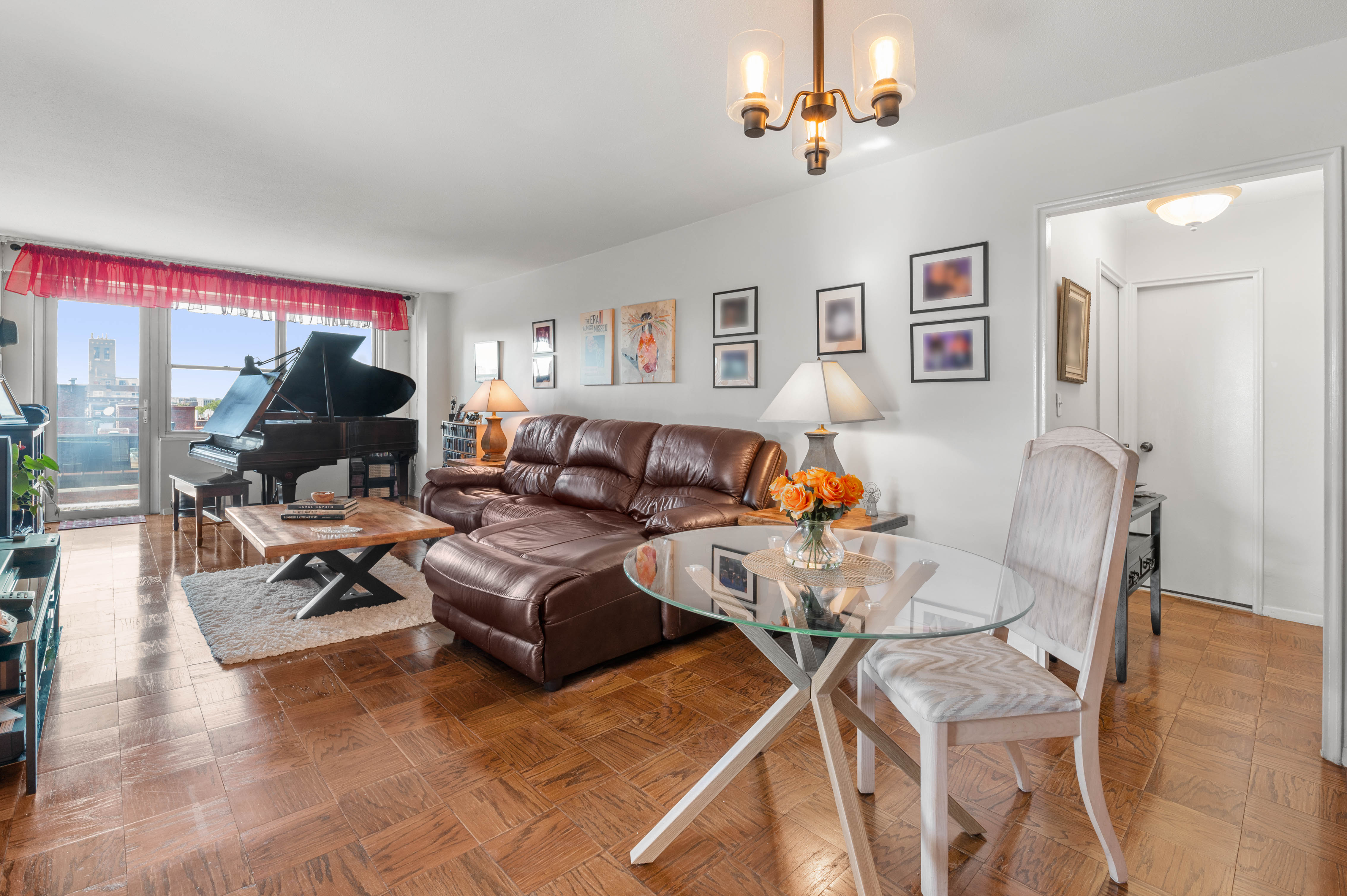 a living room with furniture a couch and a flat screen tv