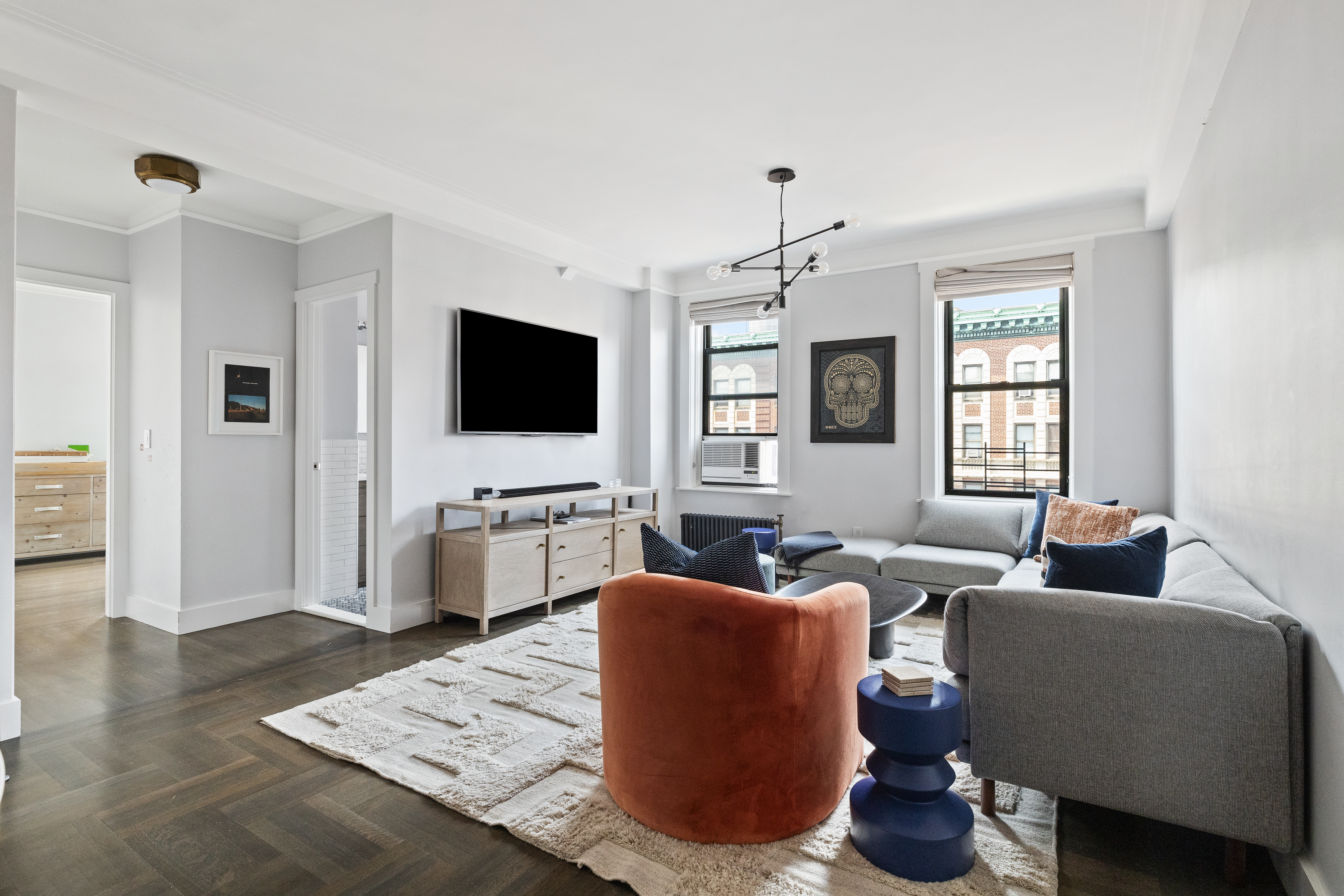 a living room with furniture and a flat screen tv