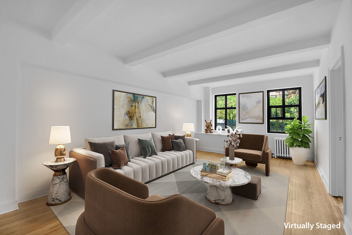 a living room with furniture and a potted plant on table