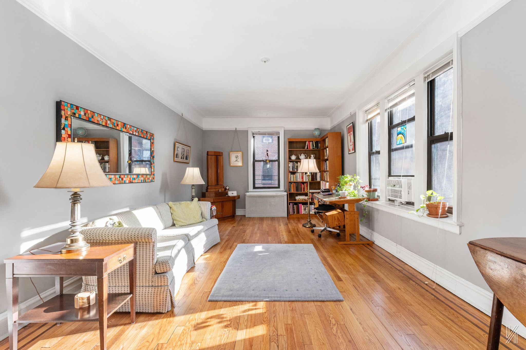 a living room with furniture and a table