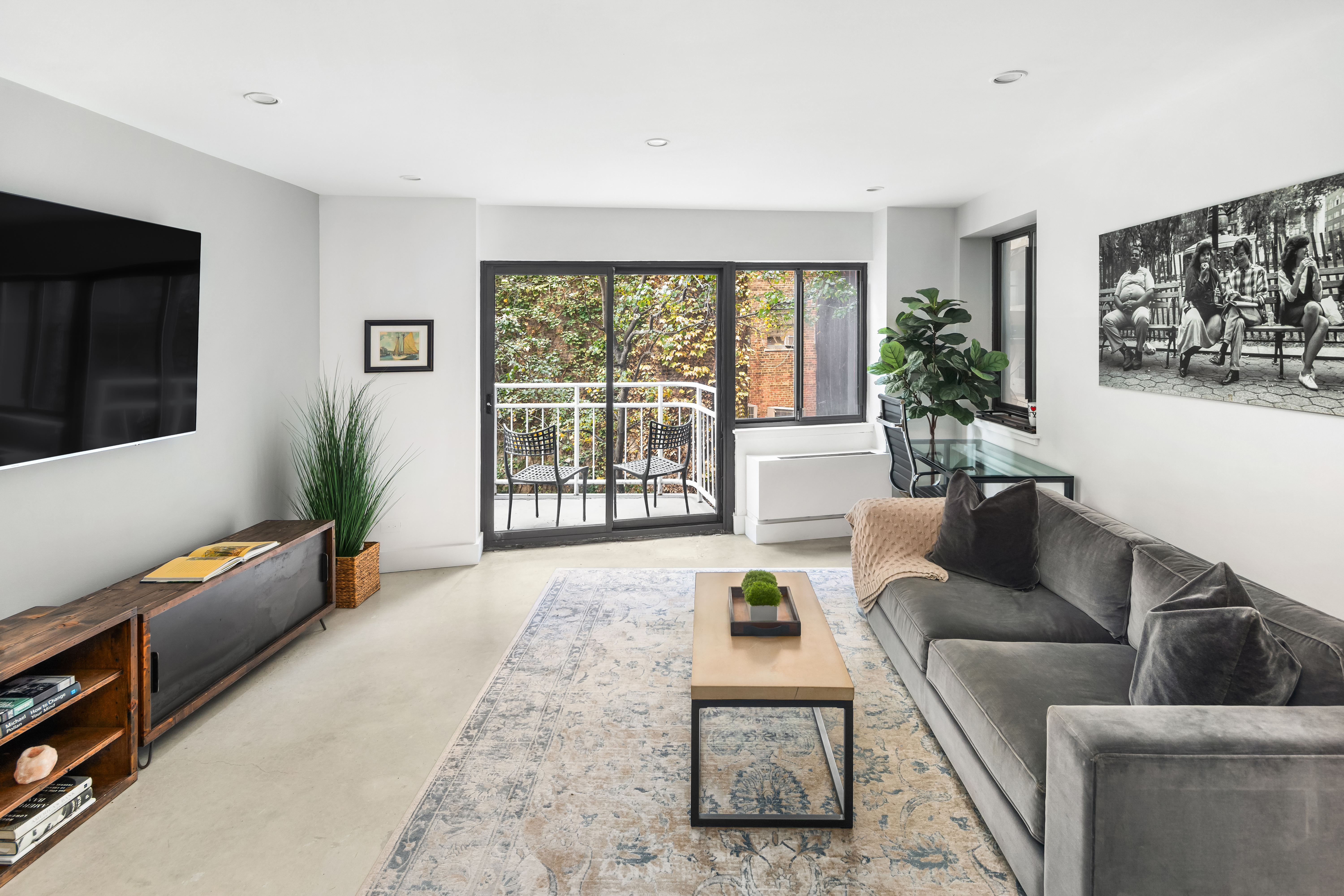 a living room with furniture and a flat screen tv