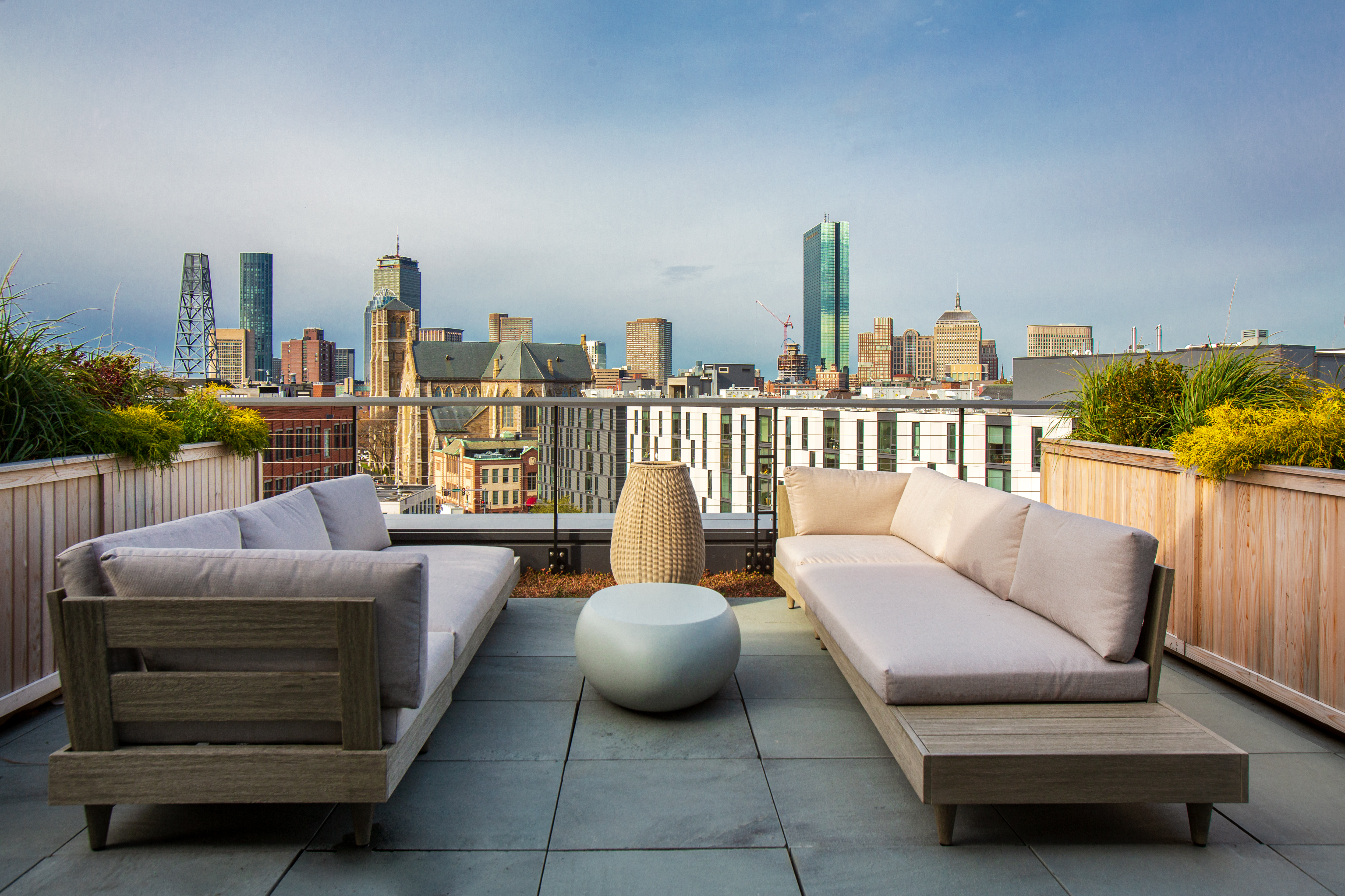 a balcony with furniture and a view