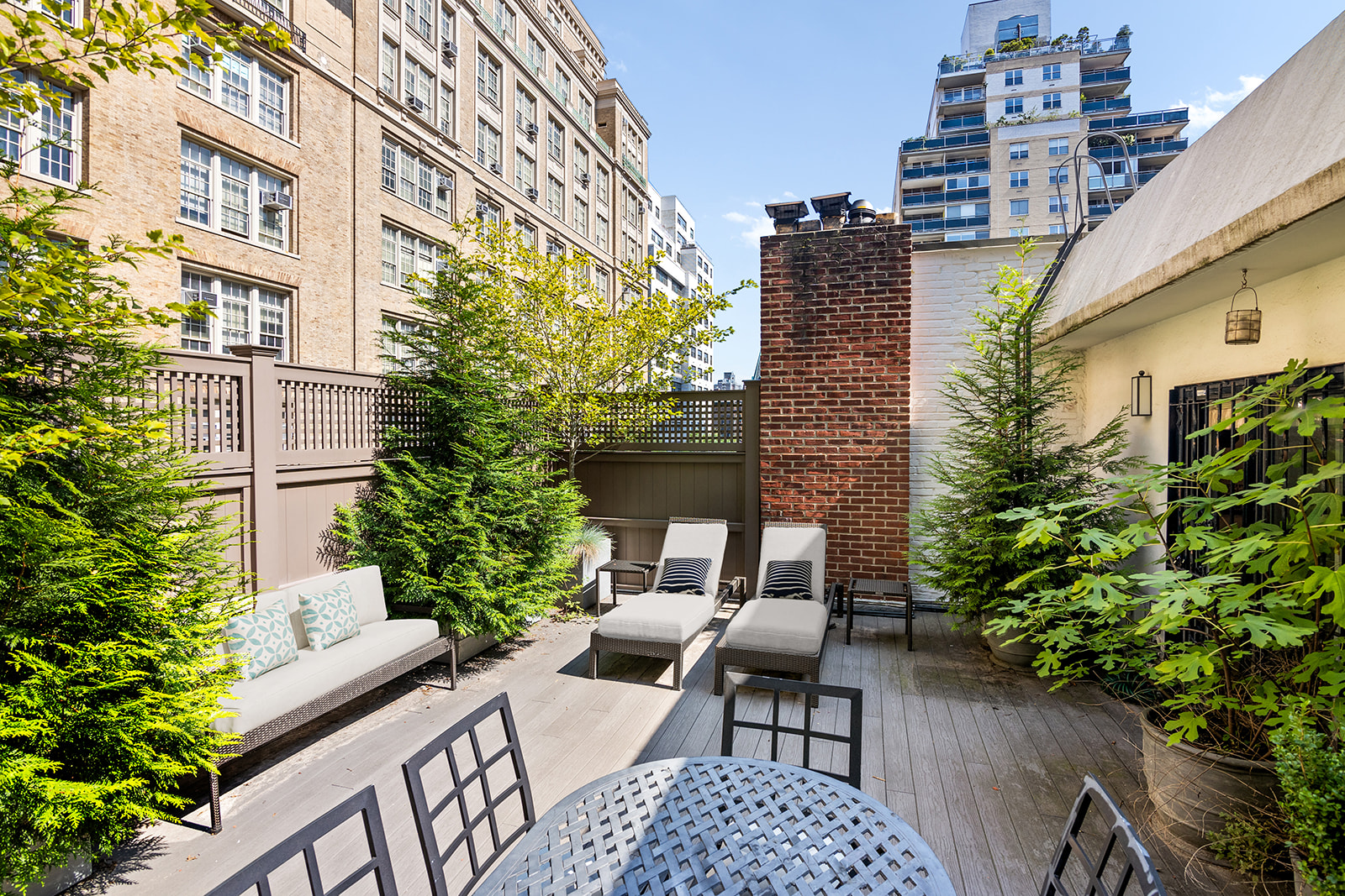 a view of balcony with outdoor seating and plants