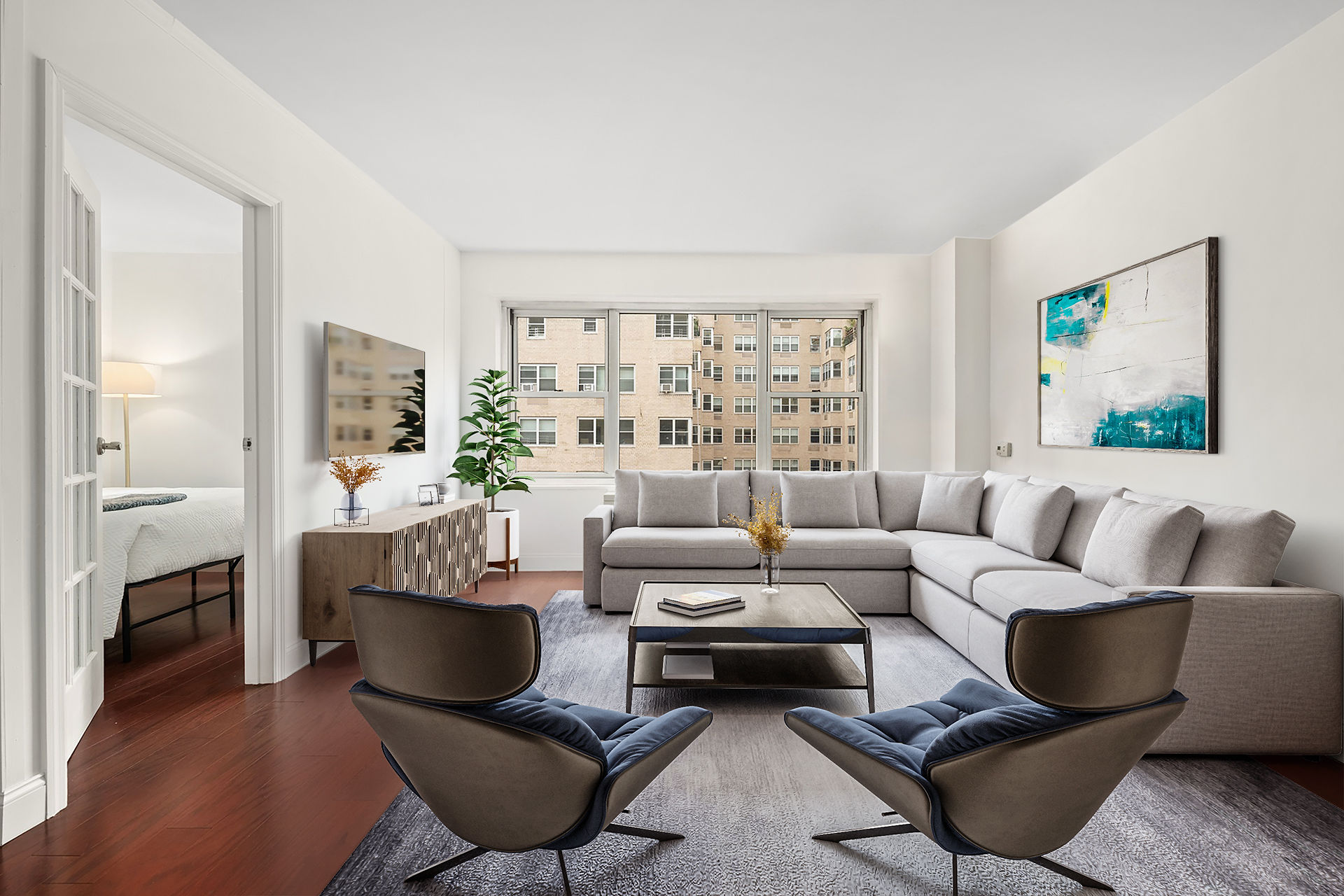 a living room with furniture and a large window