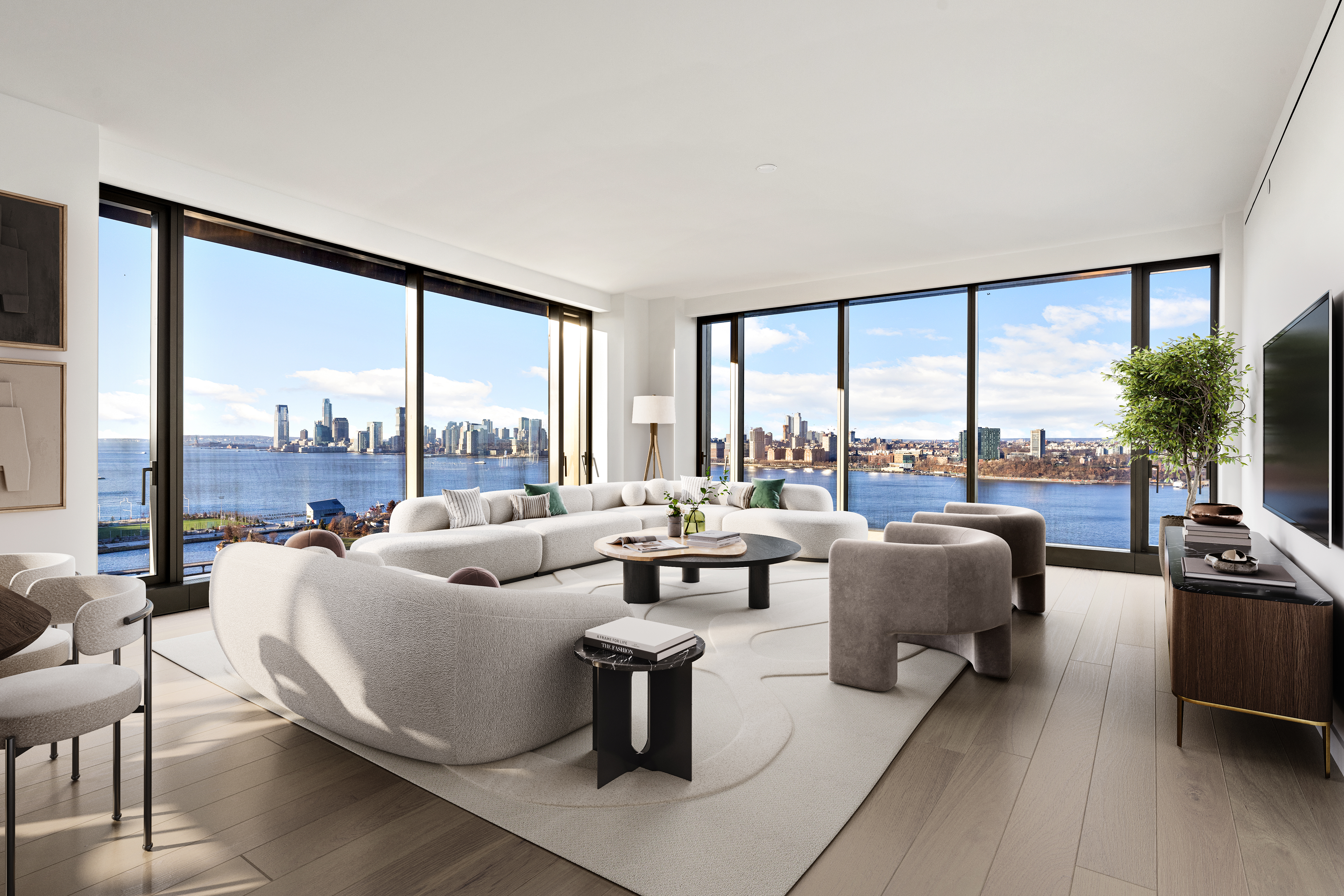 a living room with furniture and floor to ceiling windows