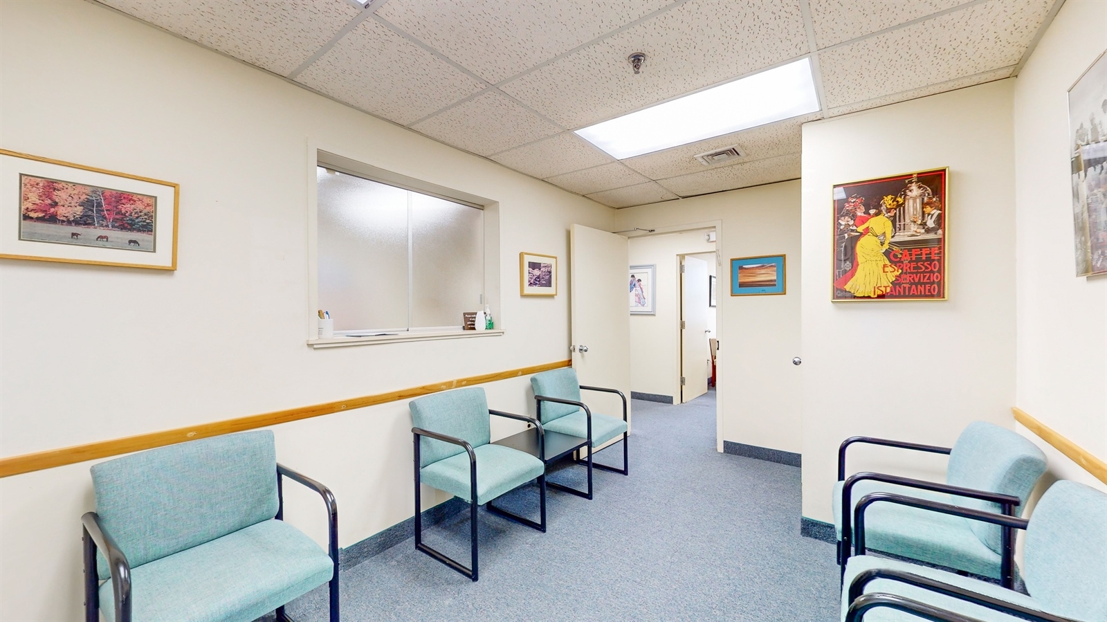 a hallway with chairs and stairs