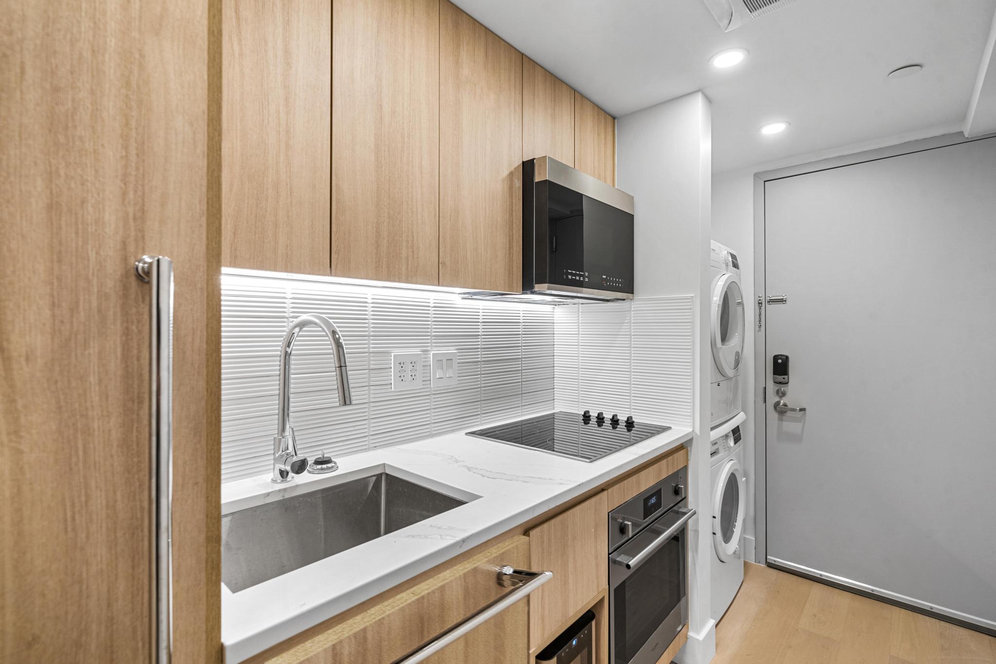 a kitchen with a sink and a refrigerator