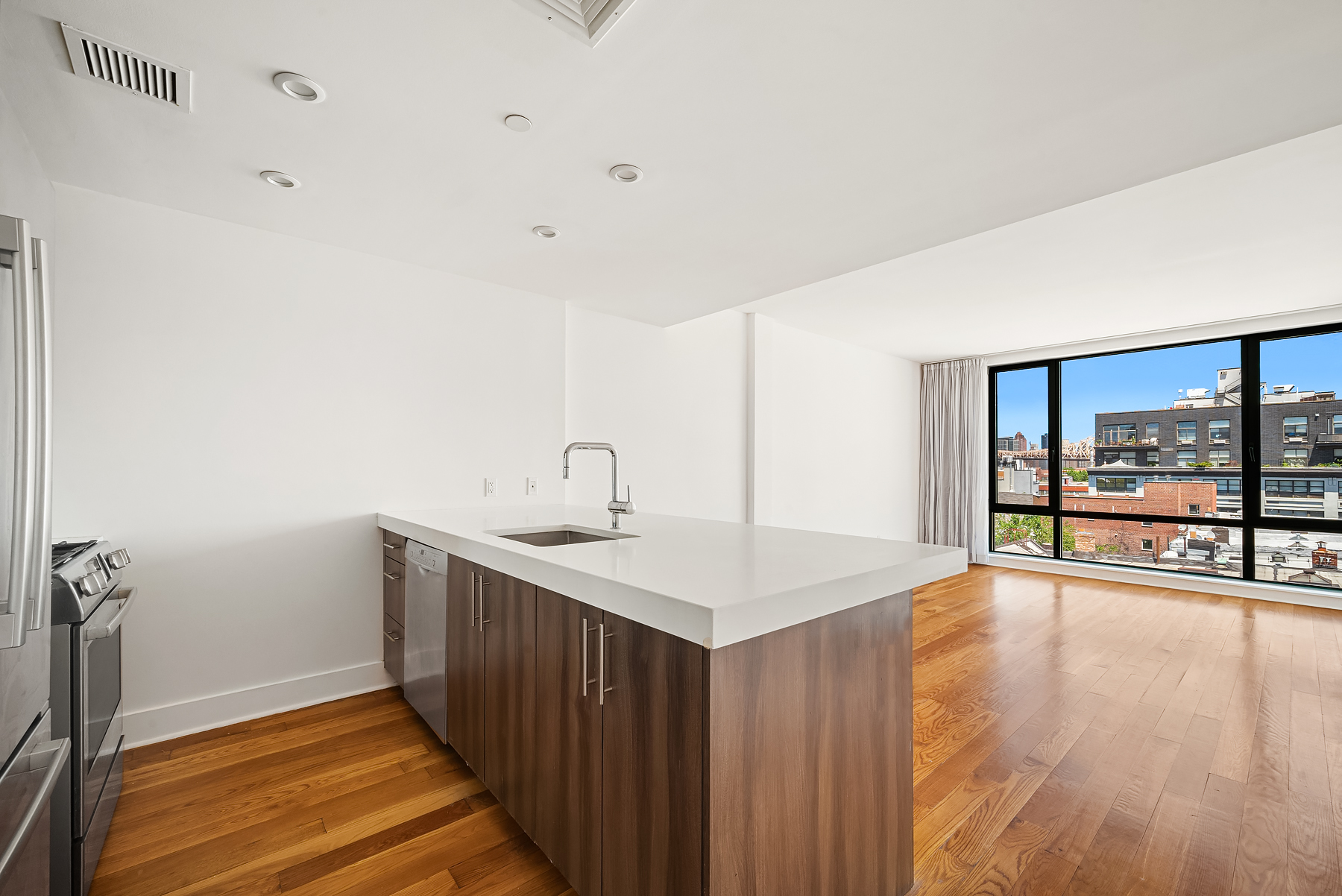 a kitchen with sink and cabinets