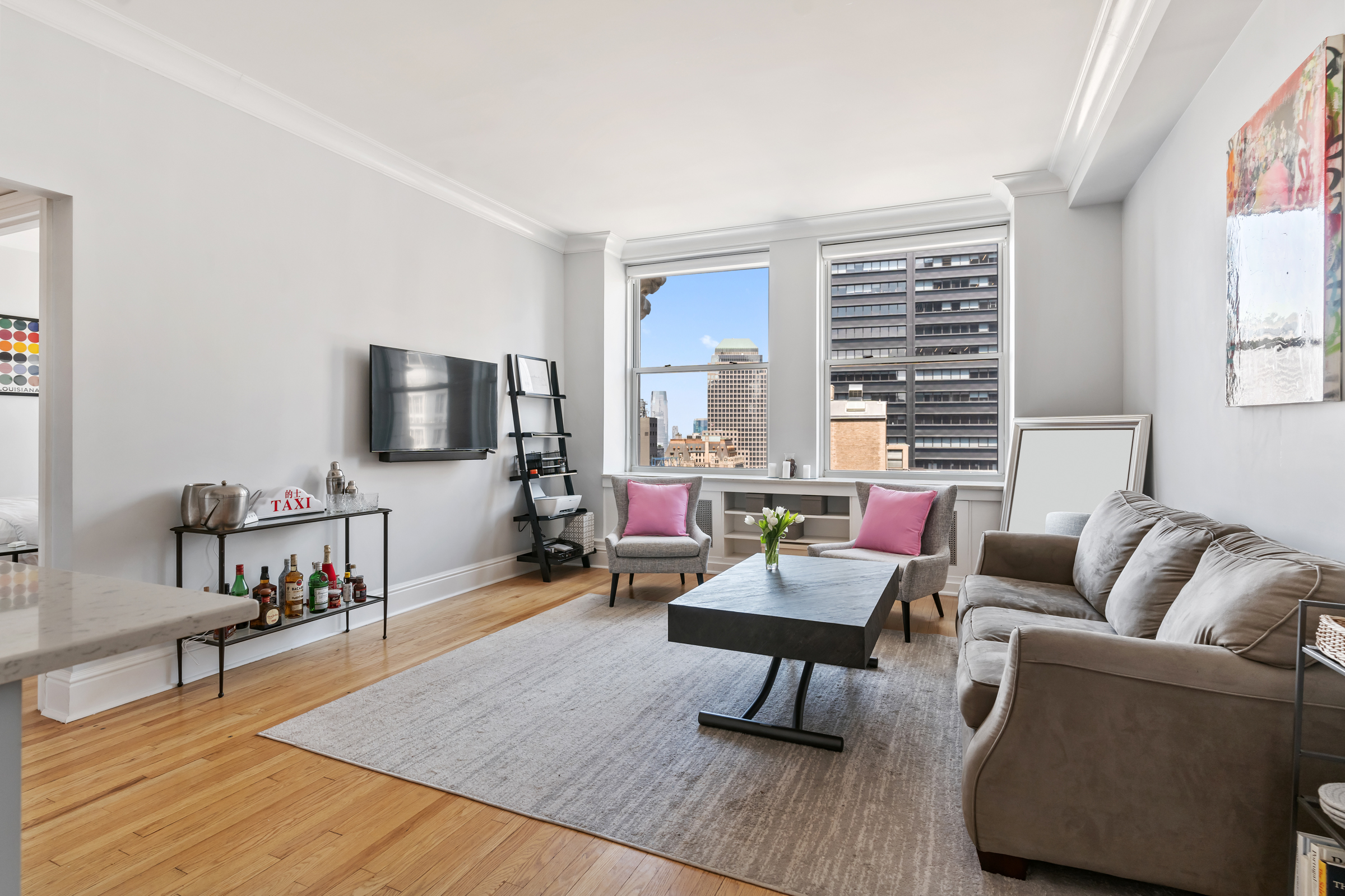 a living room with furniture and a flat screen tv