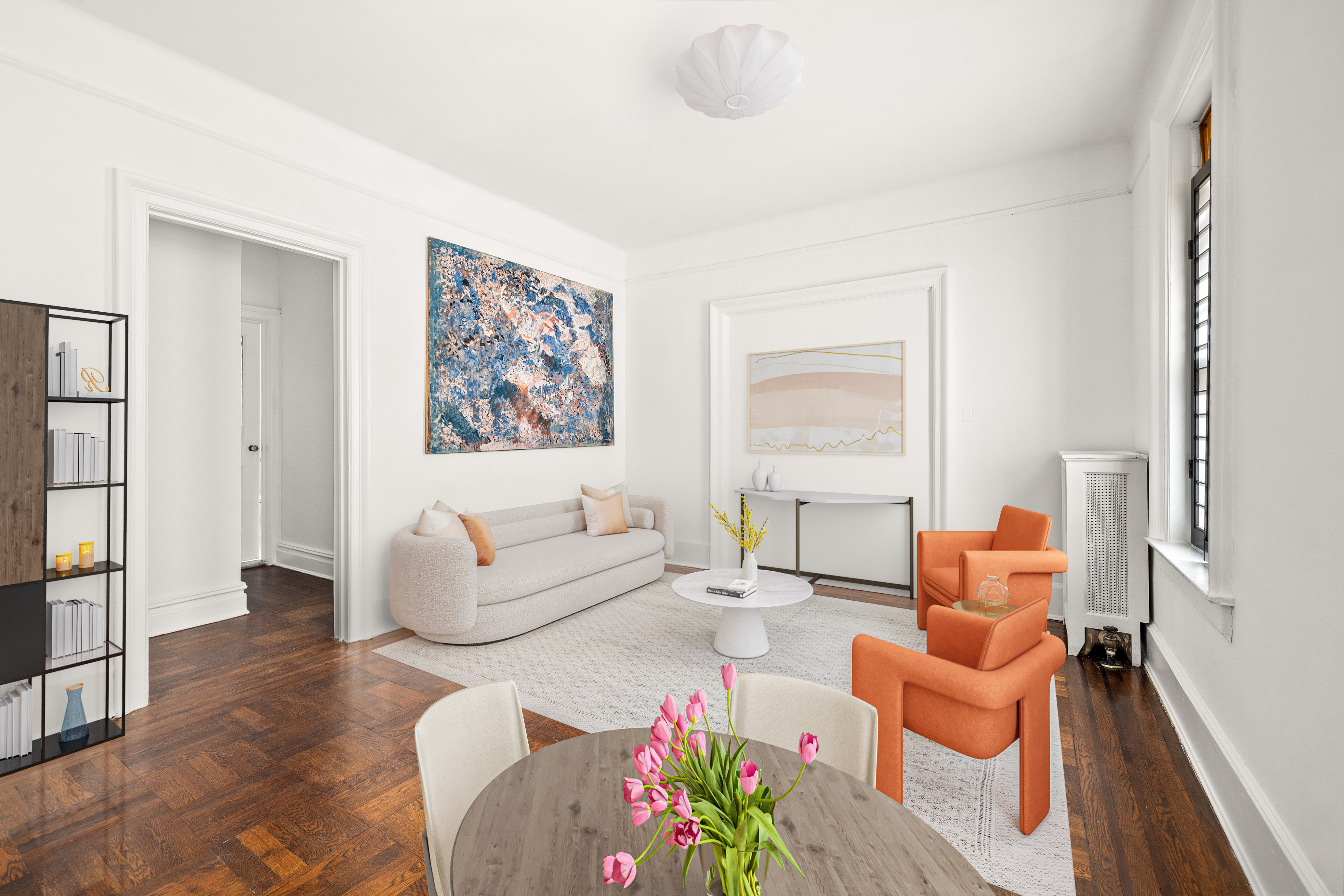 a living room with furniture and a large window