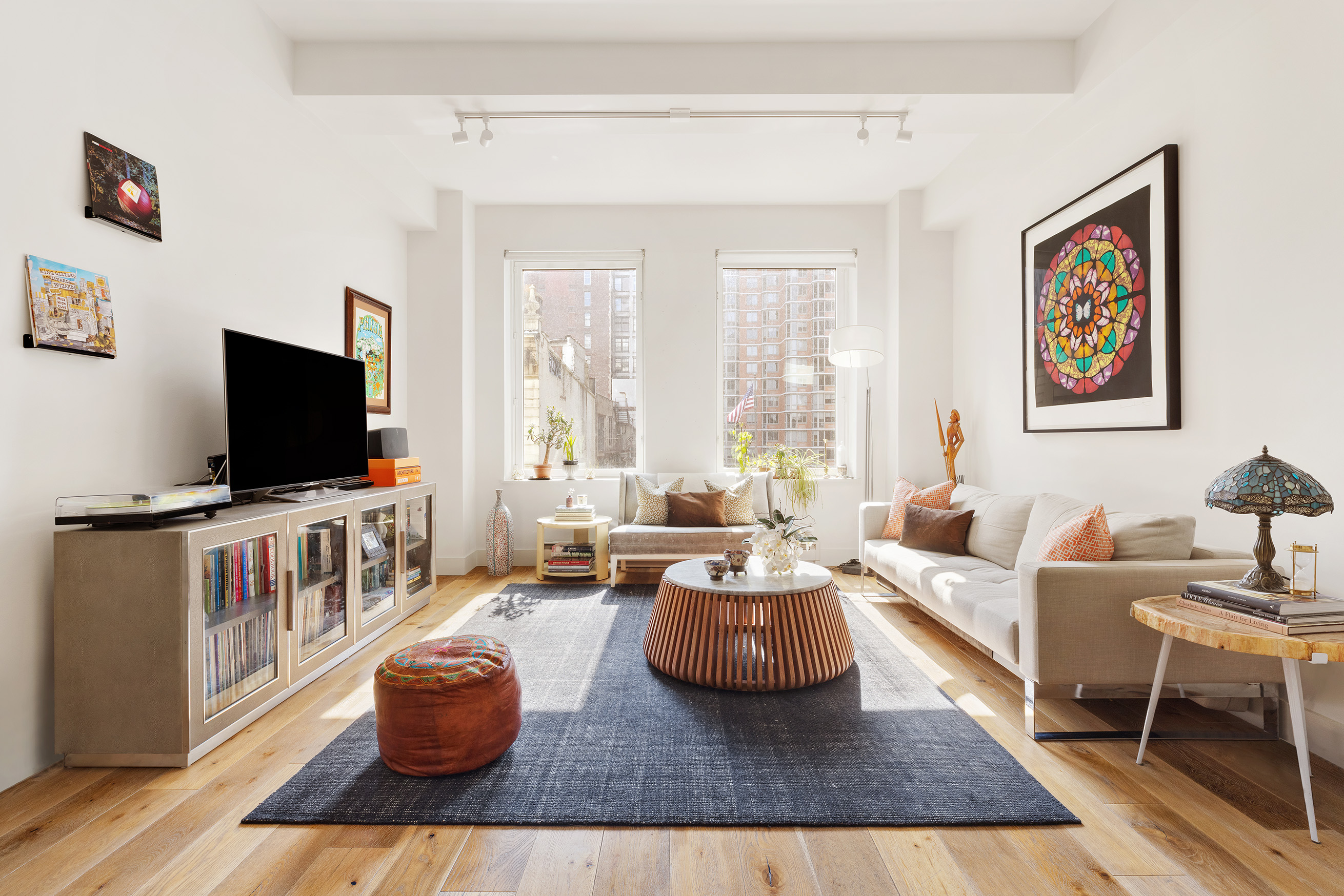 a living room with furniture and a flat screen tv