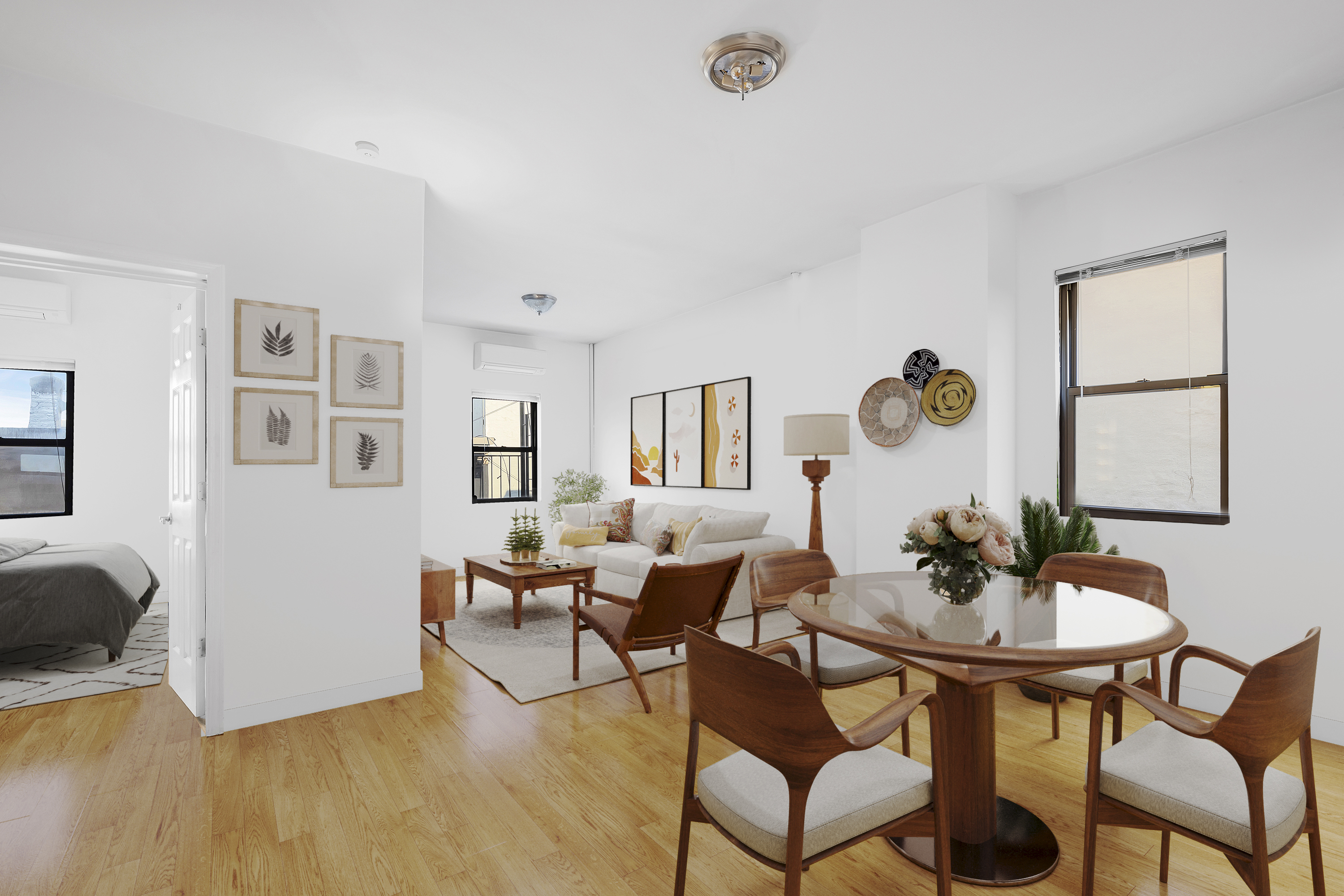 a living room with furniture and wooden floor