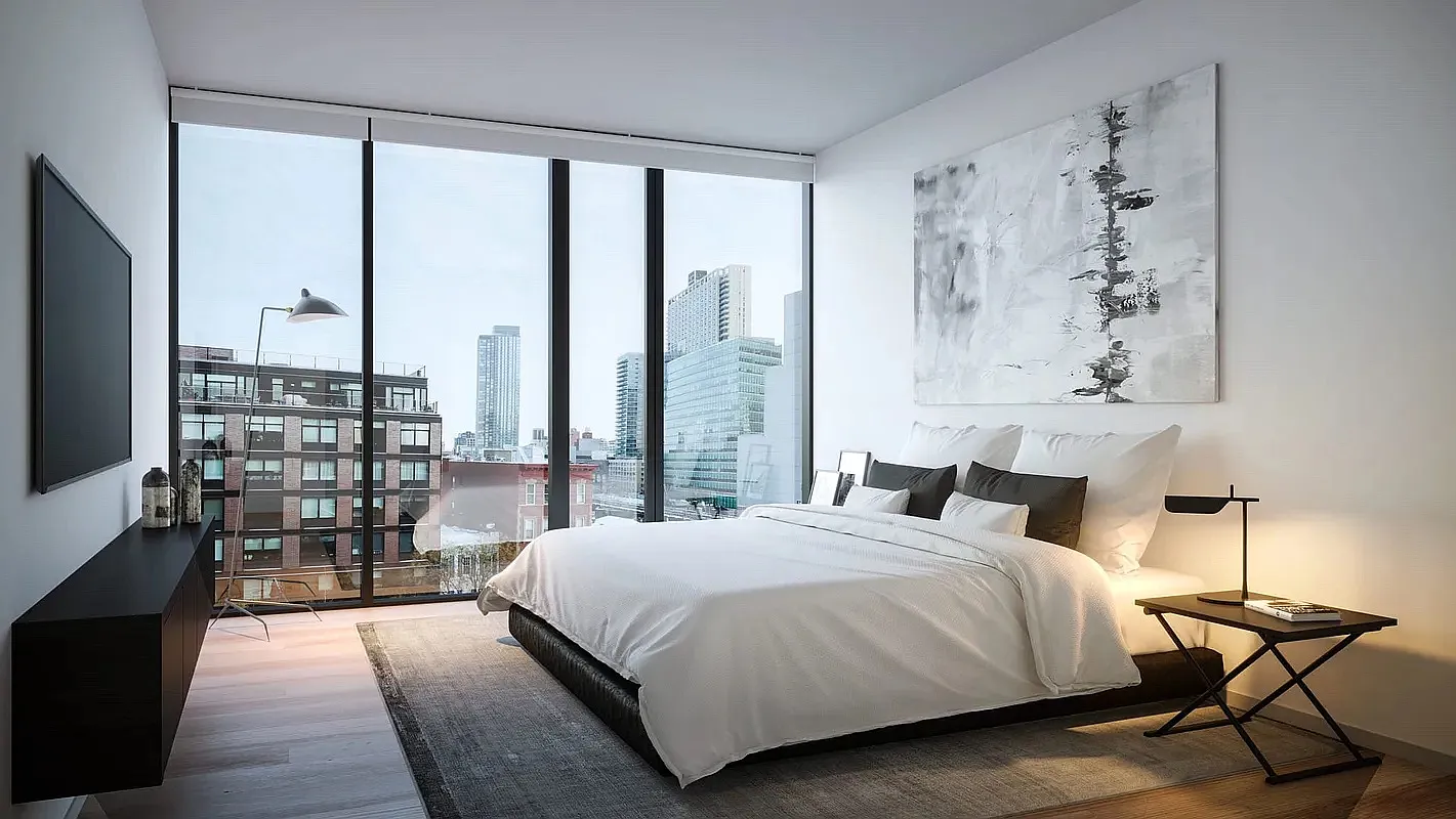 a bedroom with a large bed and a view of bedroom