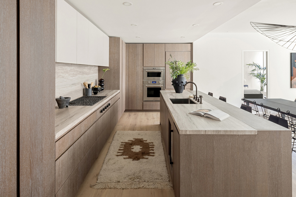 a kitchen with sink refrigerator and stove