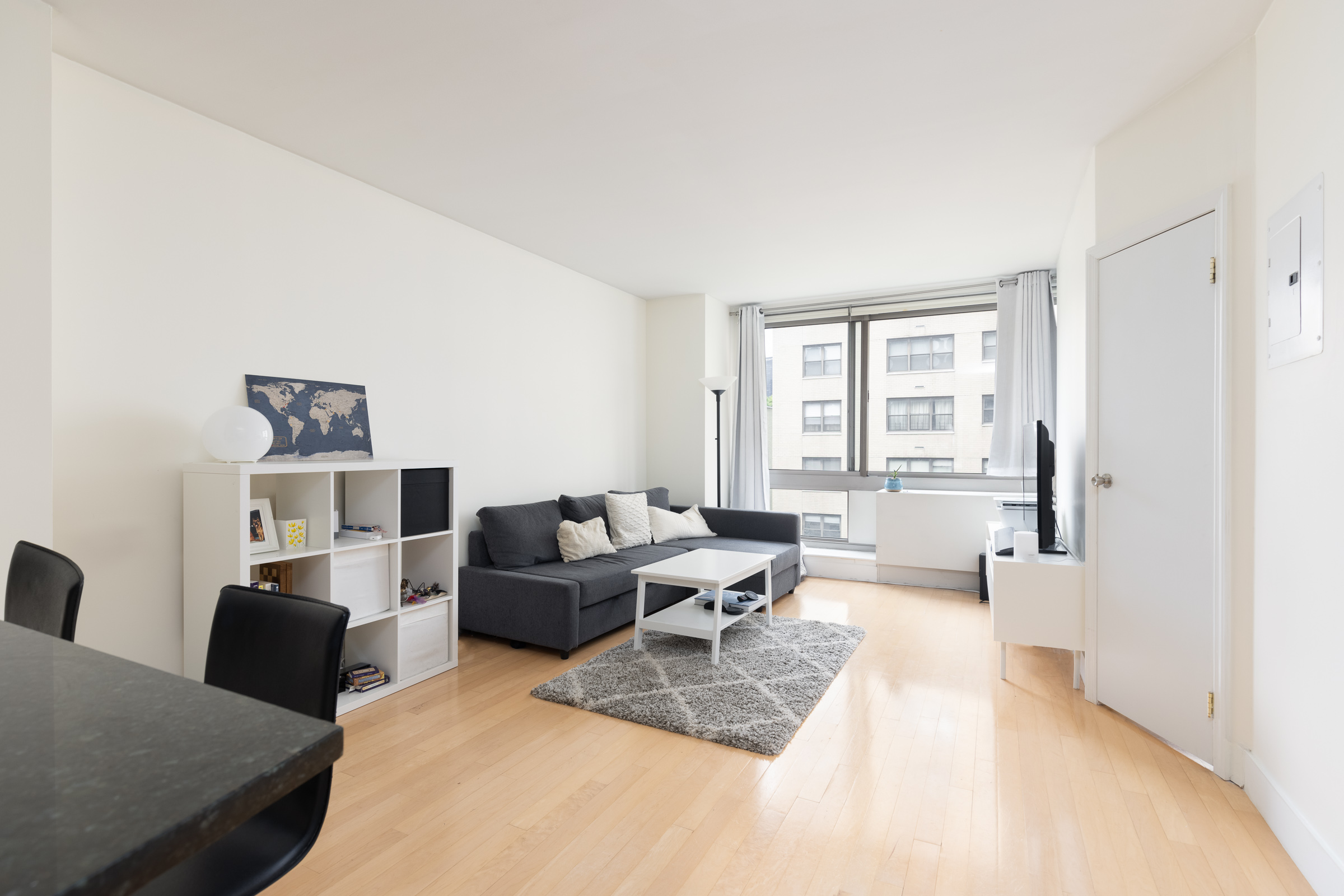 a living room with furniture and a window