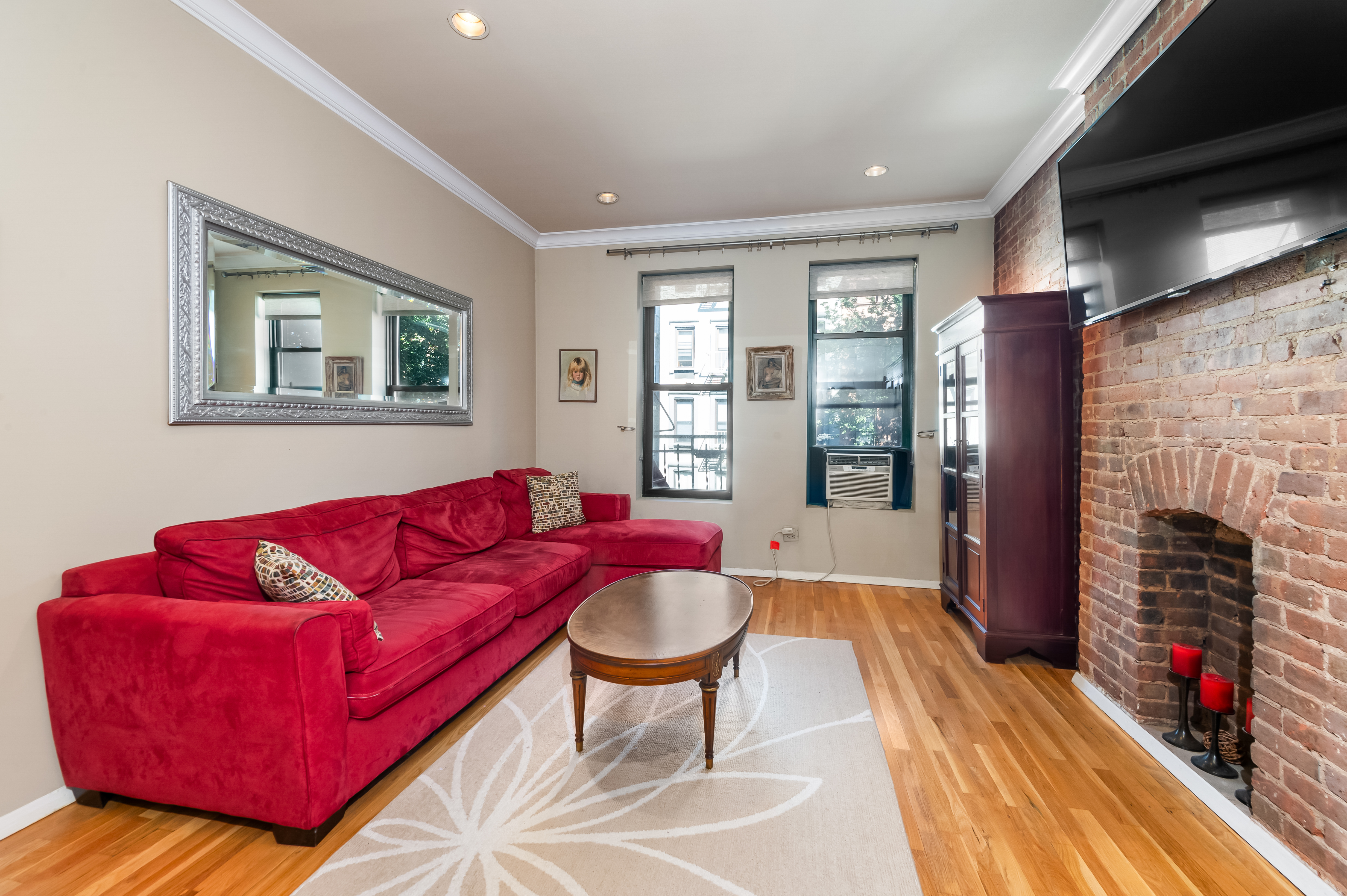 a living room with furniture and a fireplace