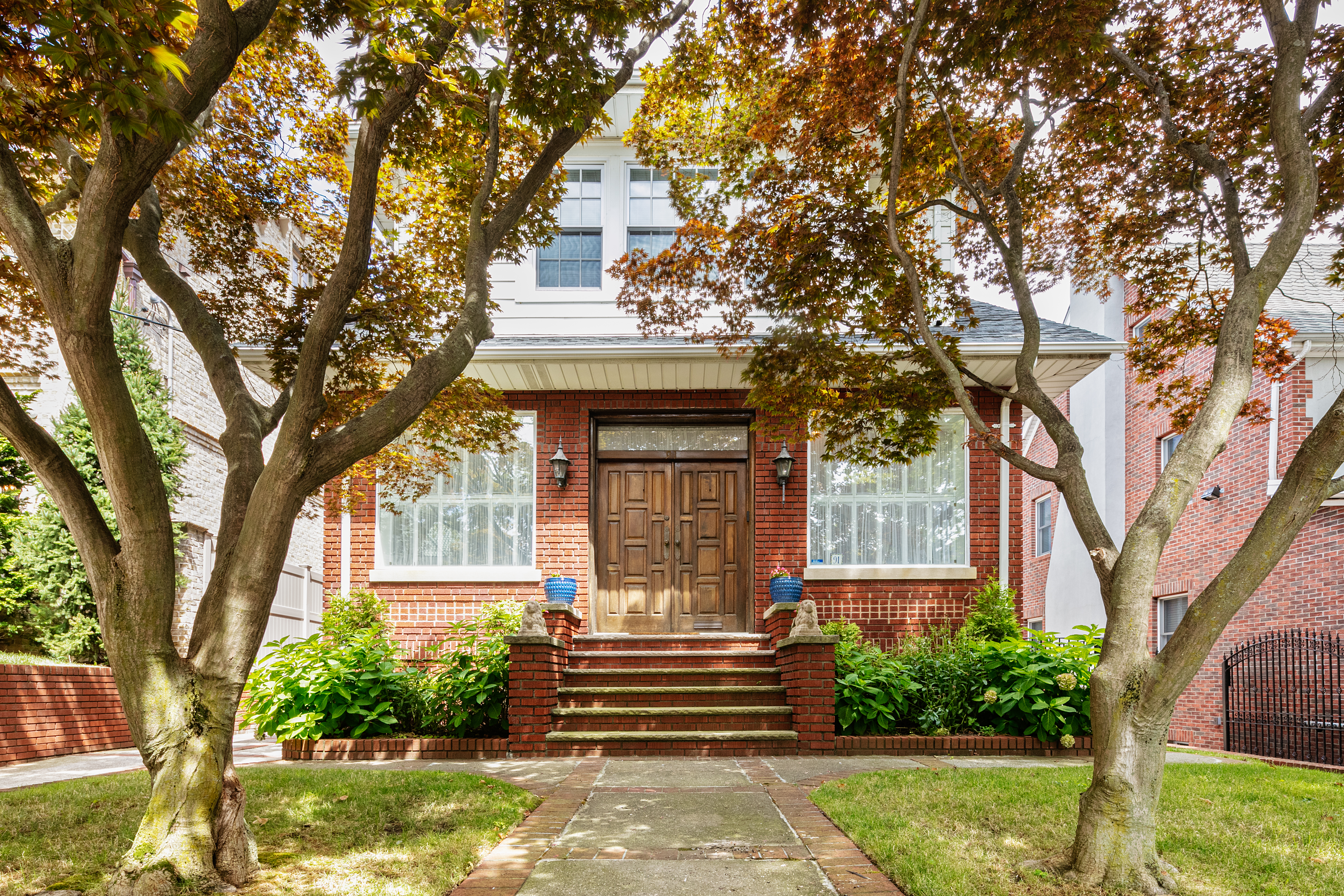 a front view of a house with a yard