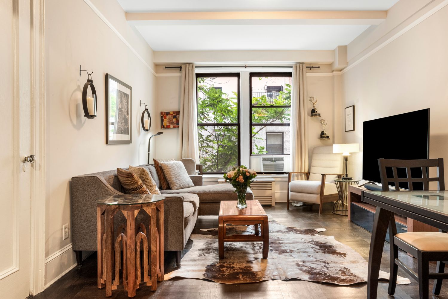 a living room with furniture and a flat screen tv