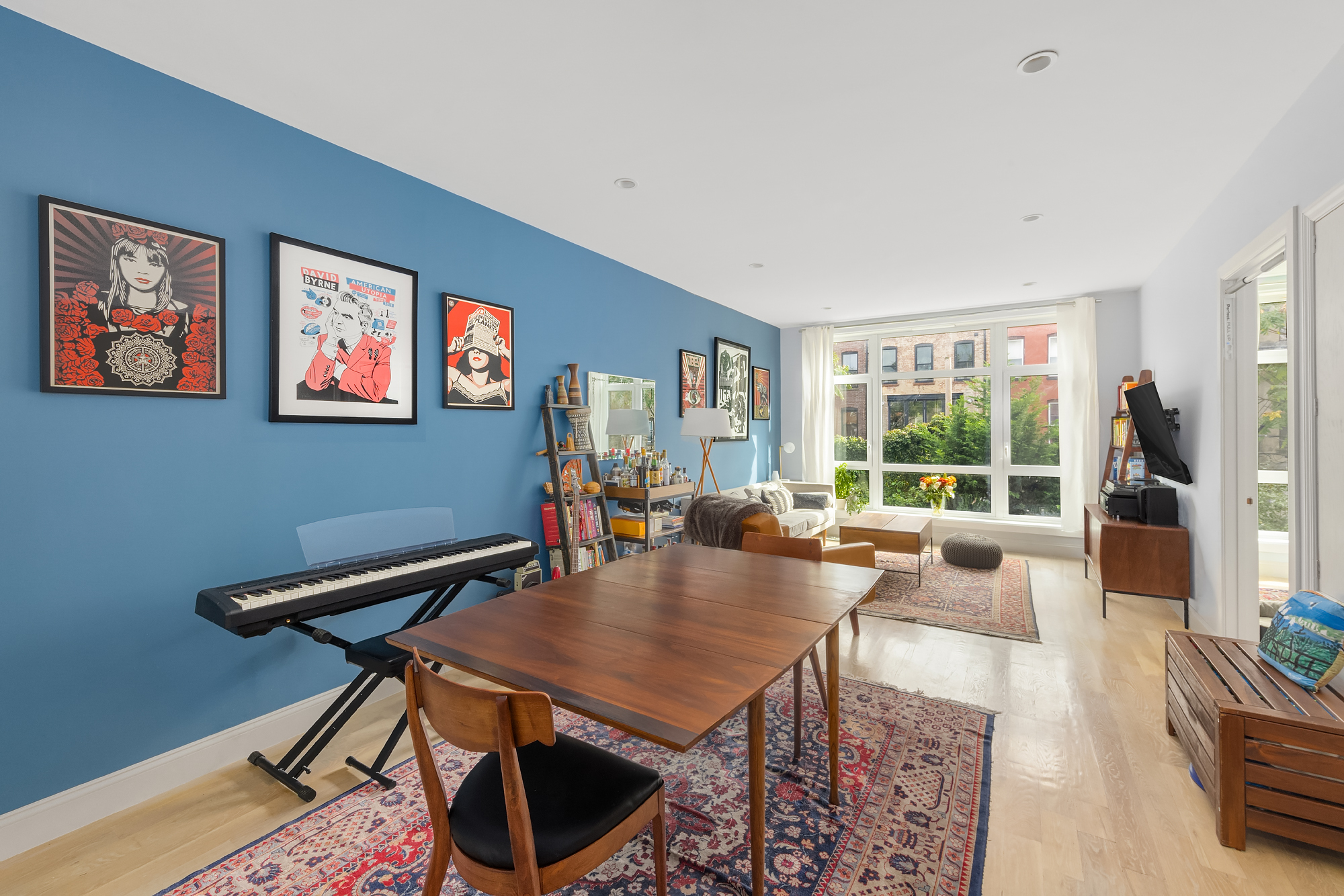 a view of a livingroom with furniture and a table