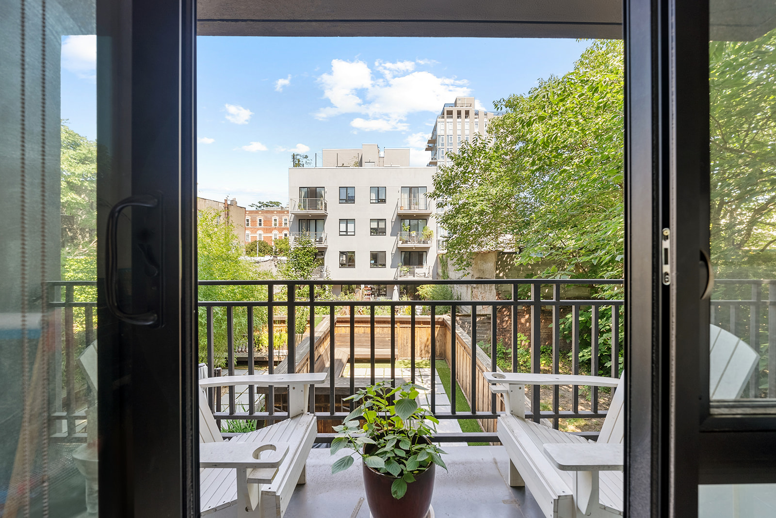 a view of a balcony with chairs