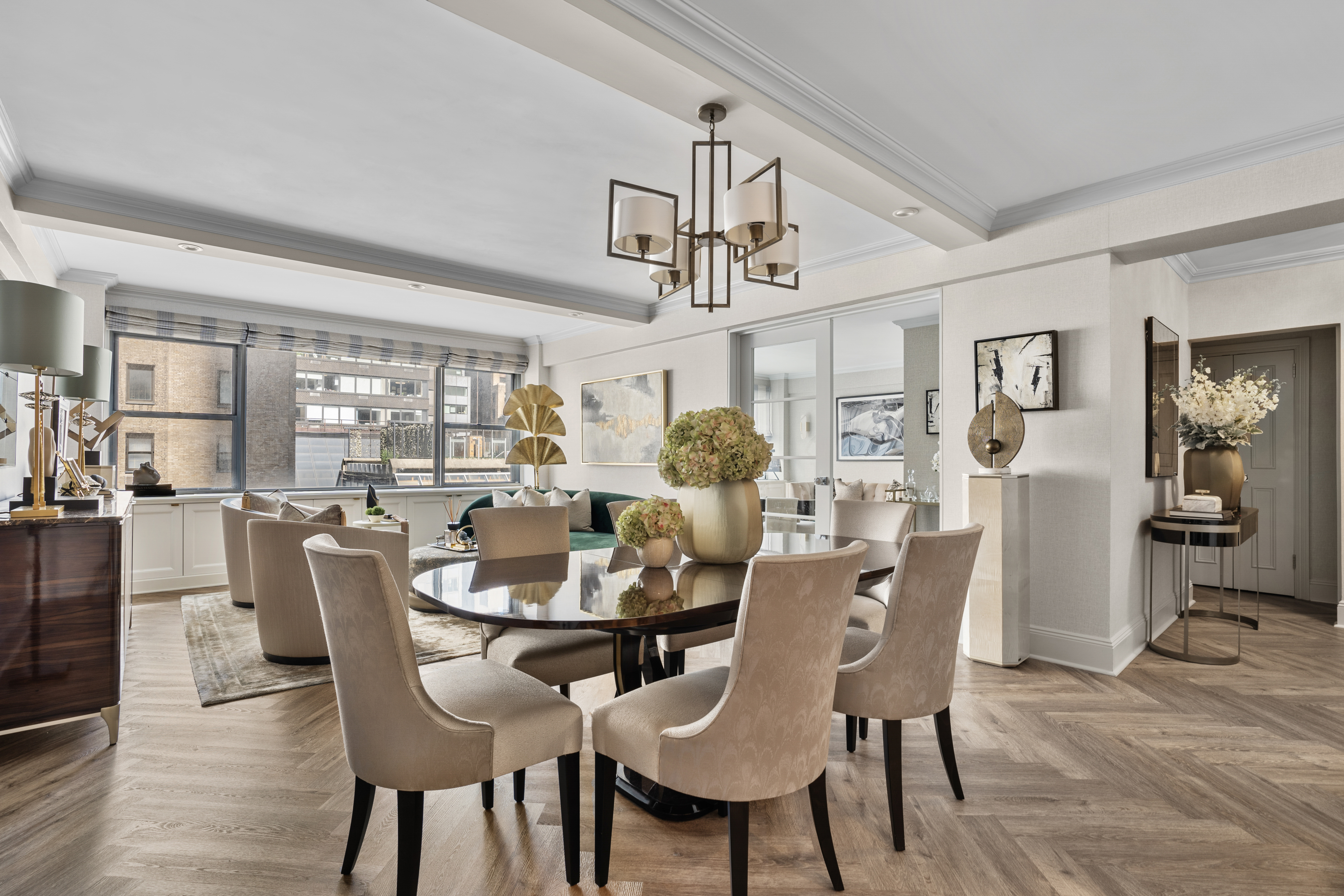 a dining room with furniture a window and wooden floor