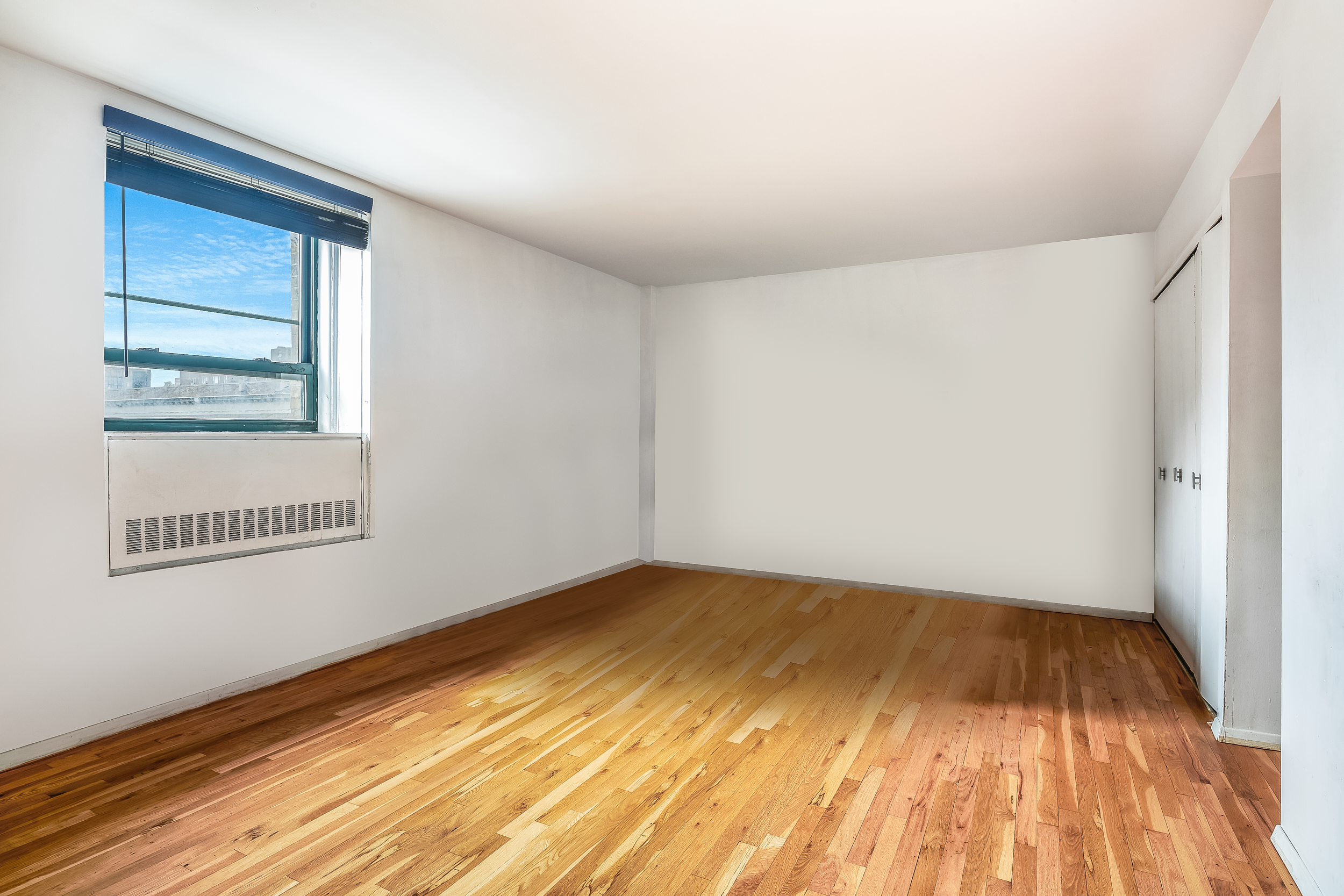 a view of an empty room and window