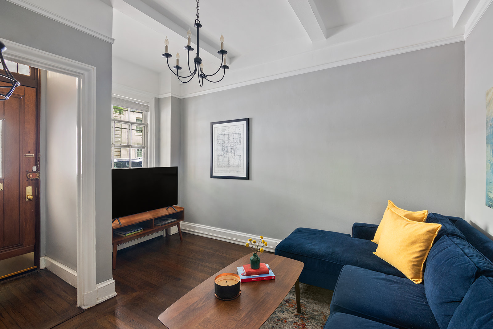 a living room with furniture and a flat screen tv