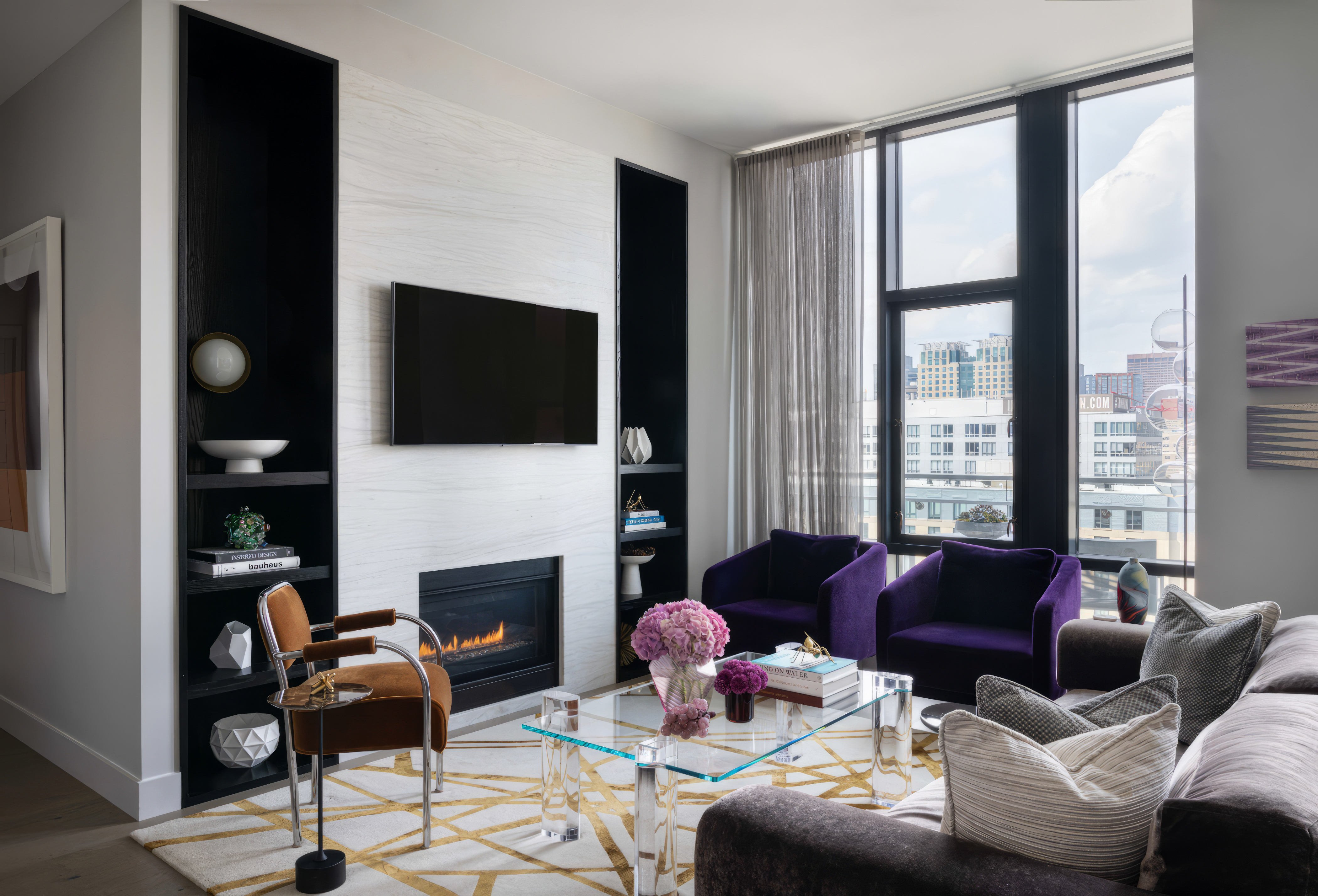 a living room with furniture a fireplace and a flat screen tv