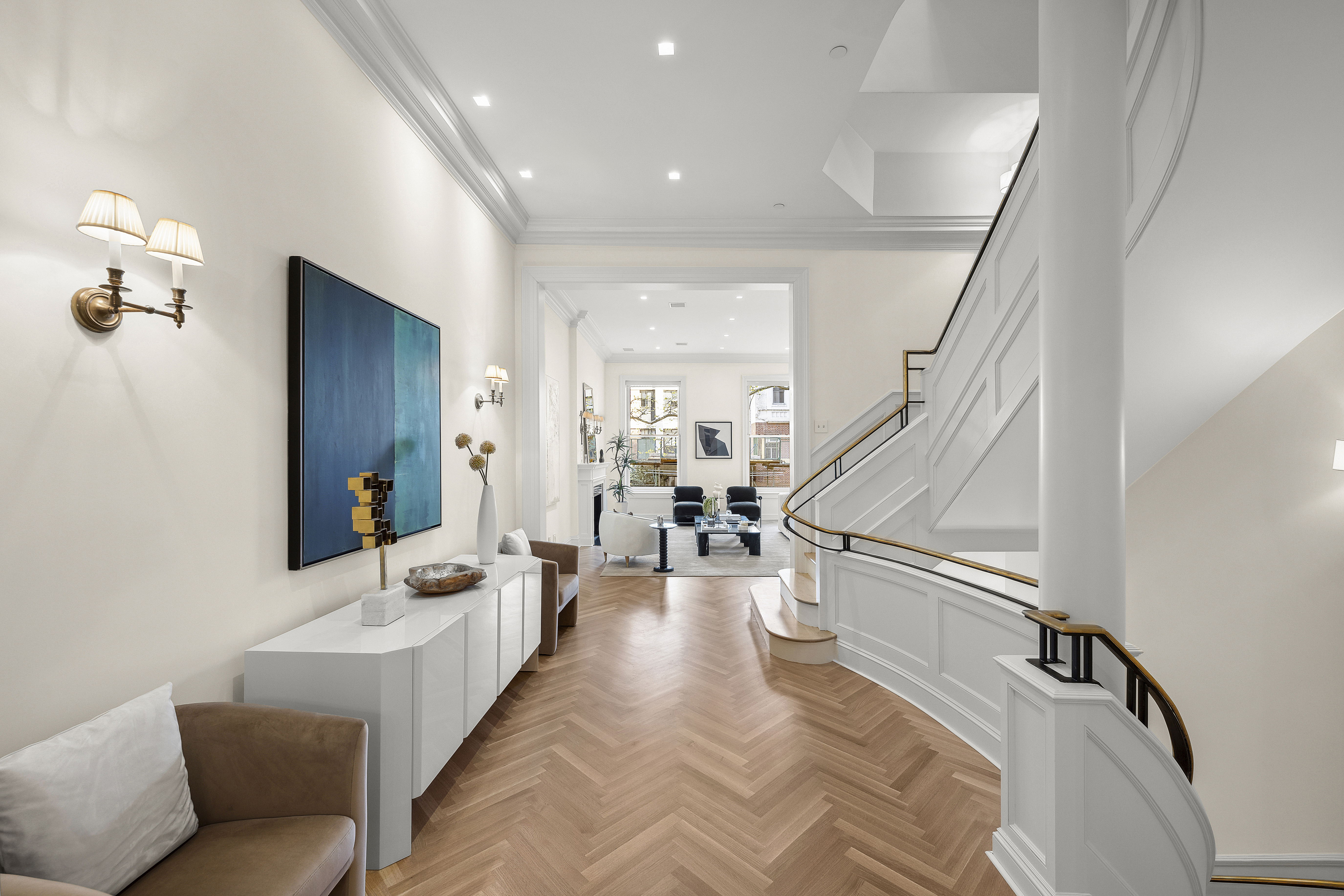 a living room with furniture and wooden floor