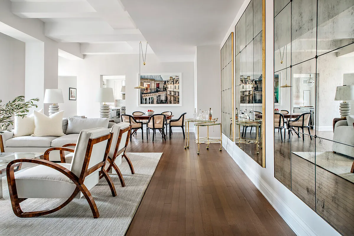 a dining room with furniture and wooden floor