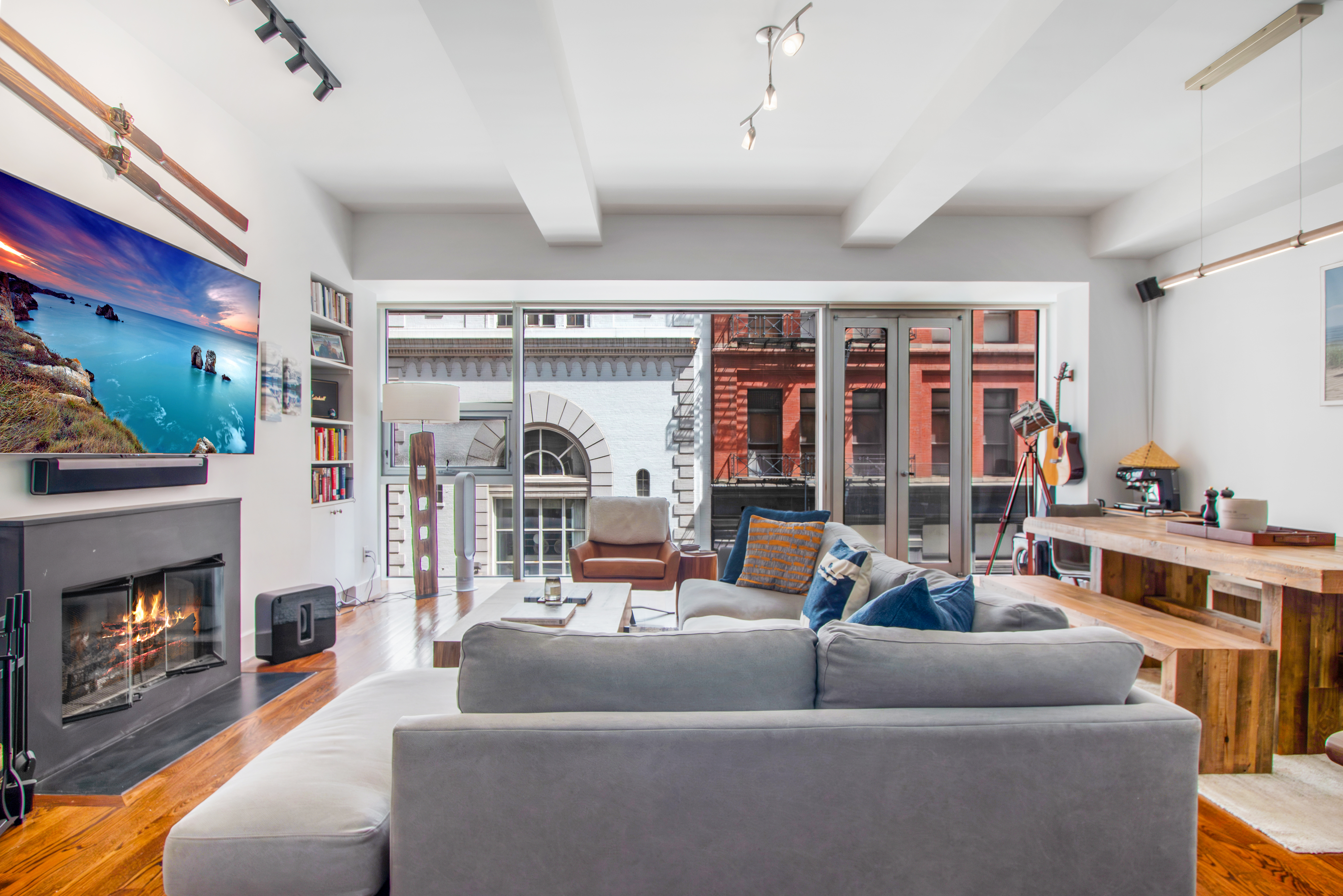 a living room with furniture and a fireplace