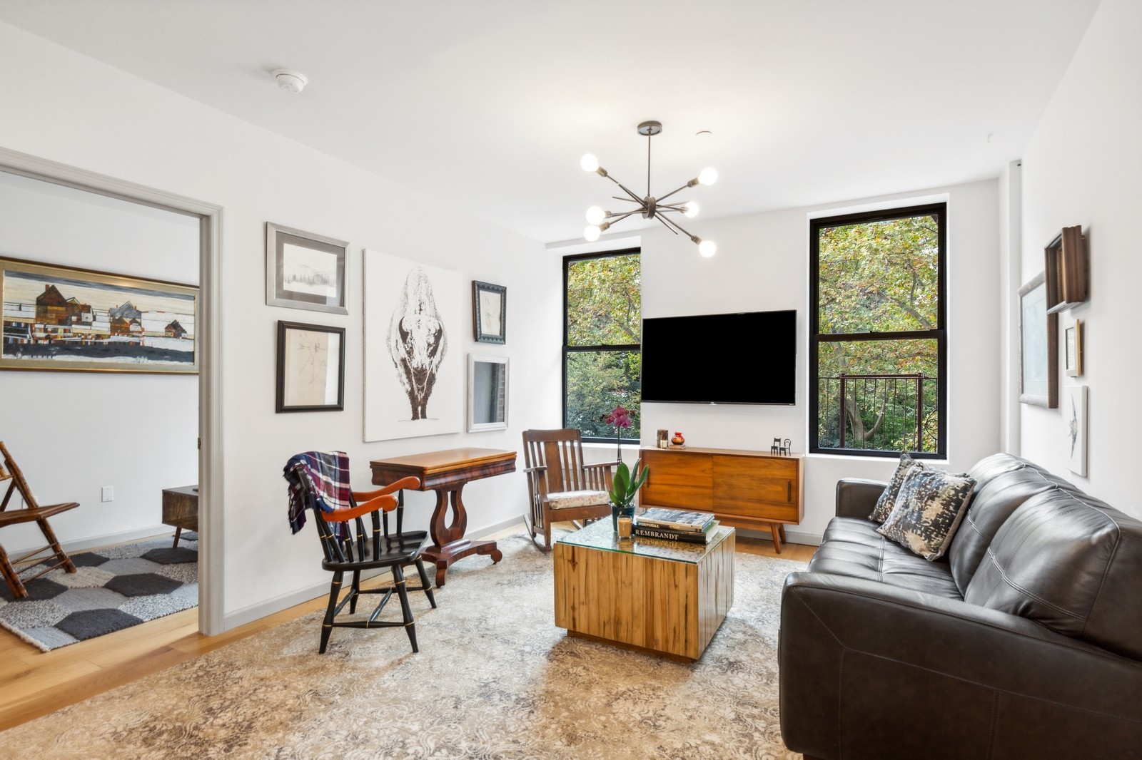 a living room with furniture and a flat screen tv