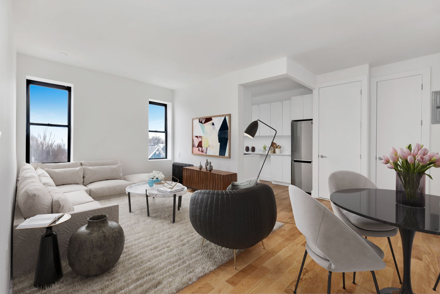 a living room with furniture and a potted plant