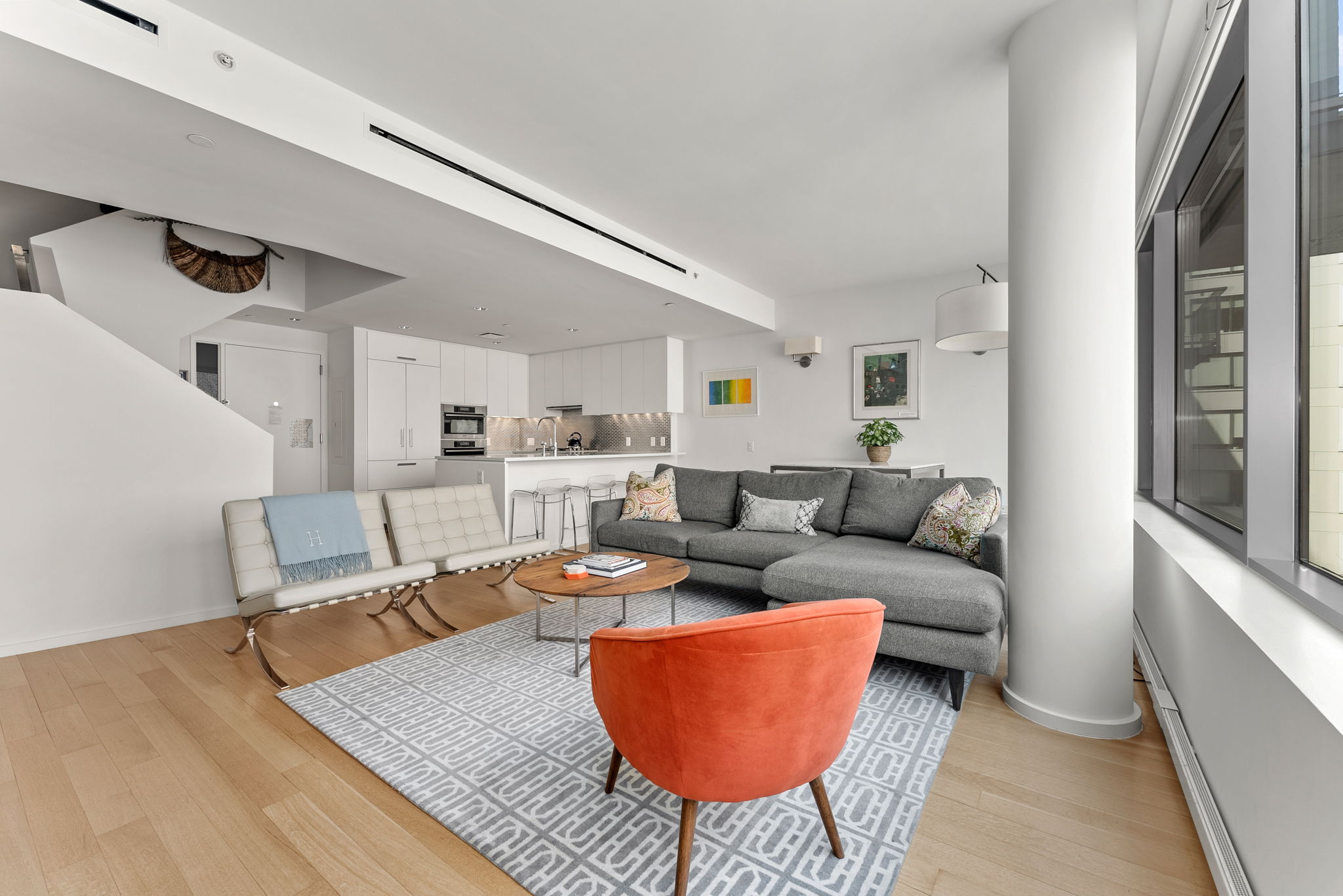 a living room with furniture and a rug