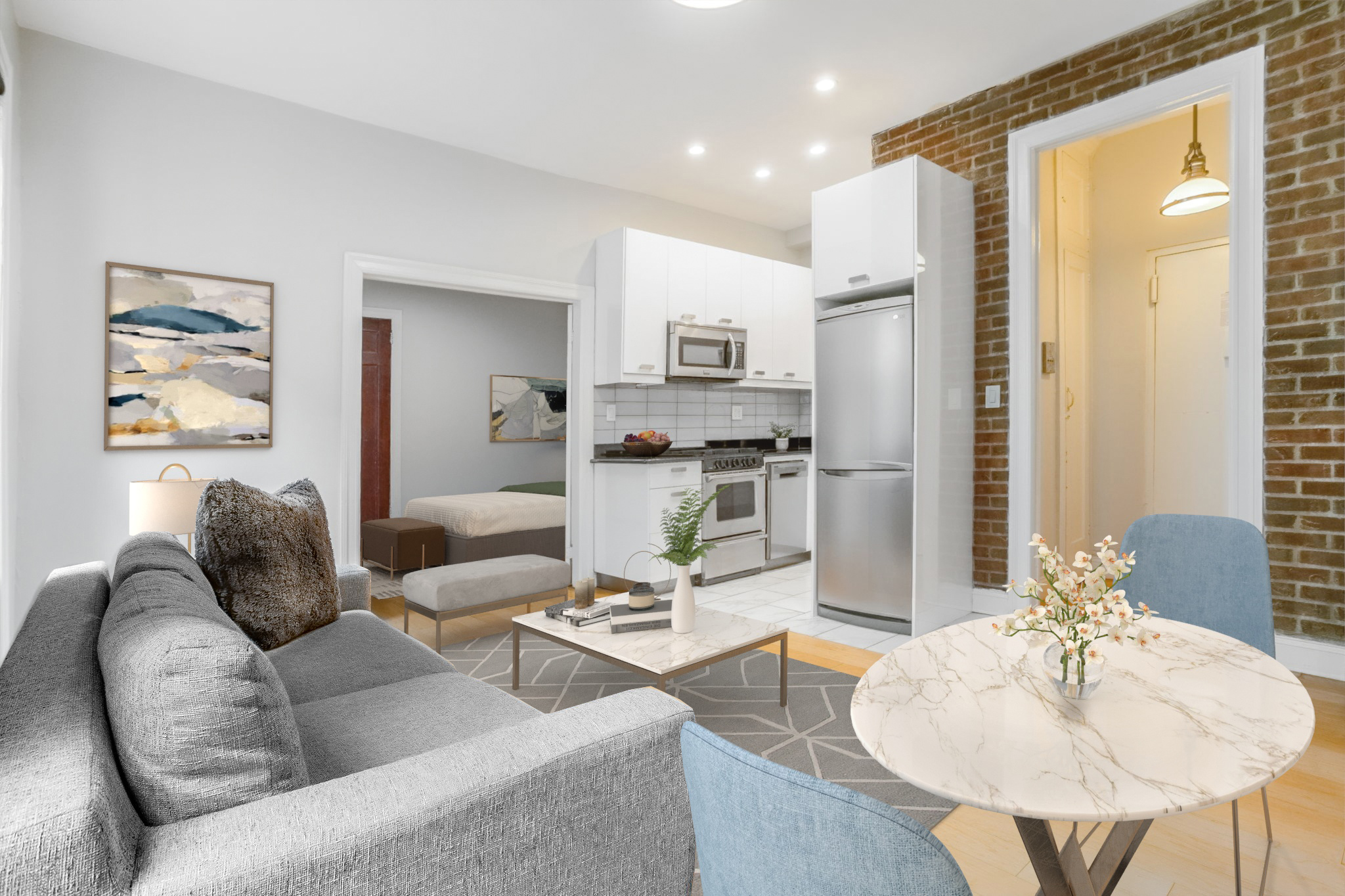 a living room with furniture and a dining table with kitchen view