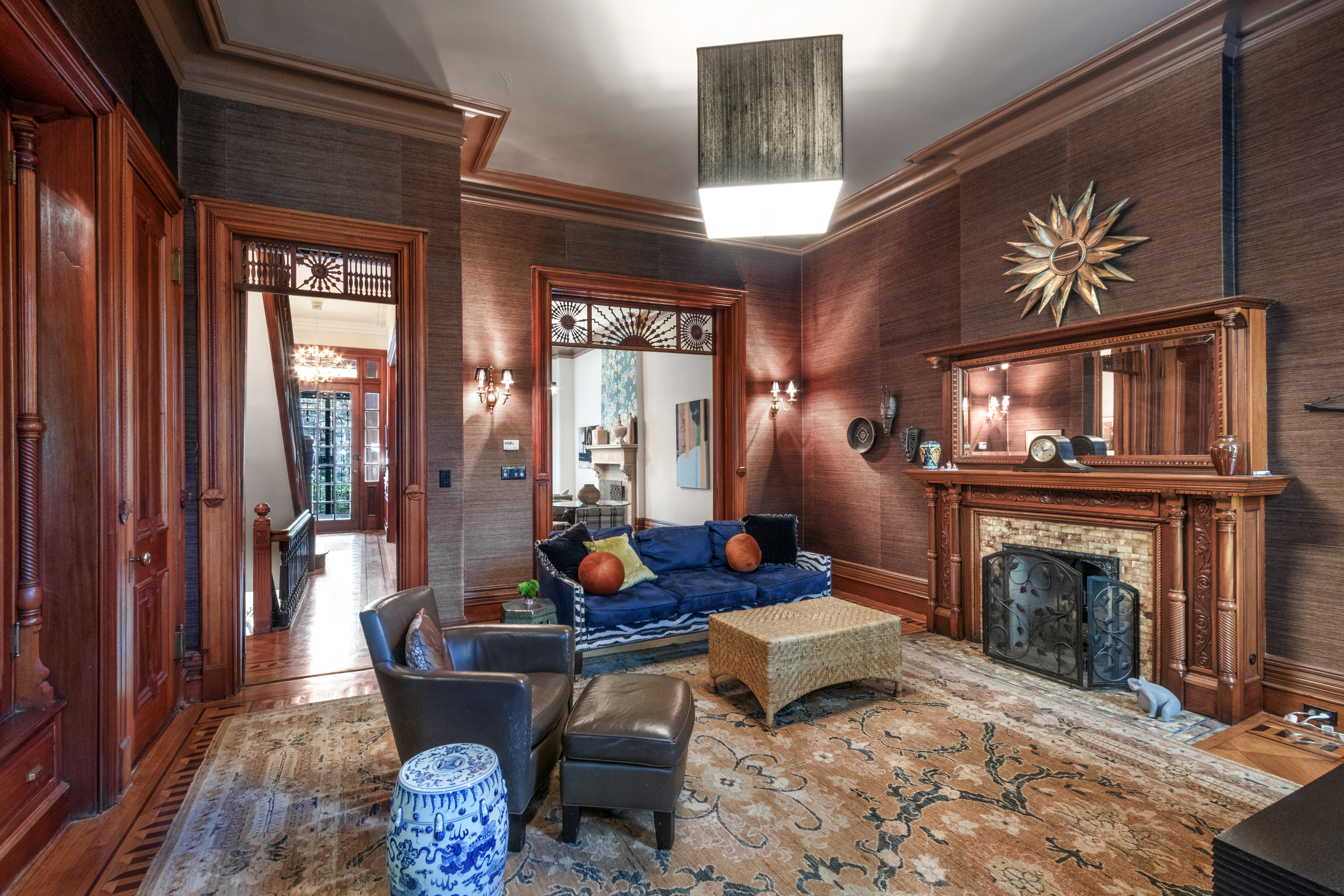 a living room with furniture a fireplace and a flat screen tv