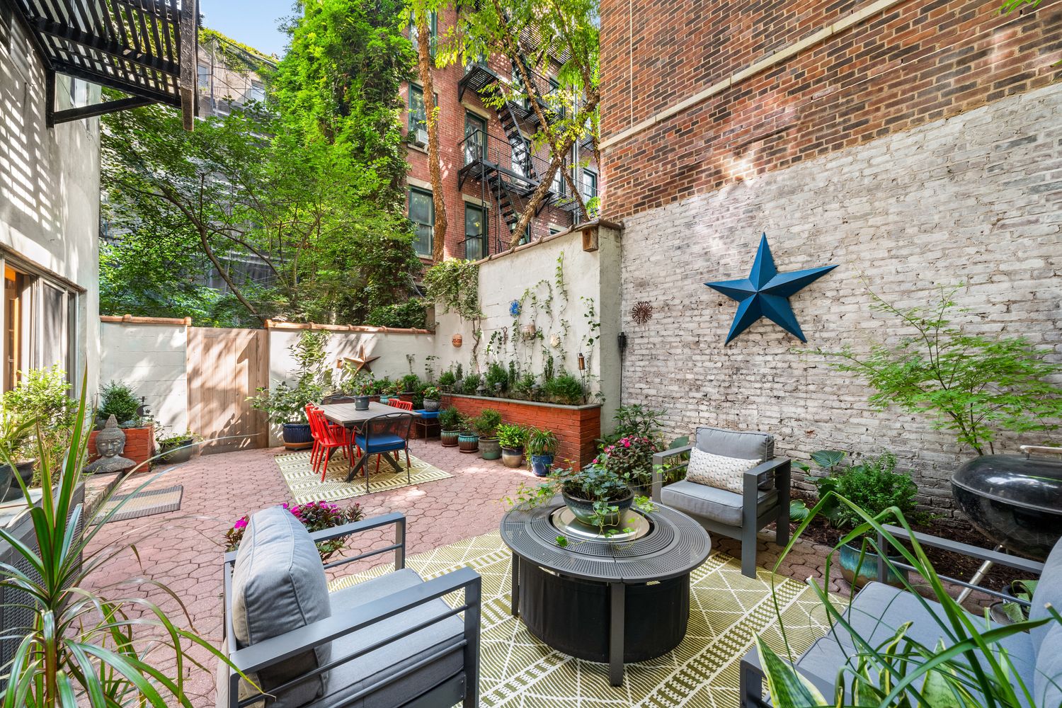 a view of a patio with couches chairs and a potted plant