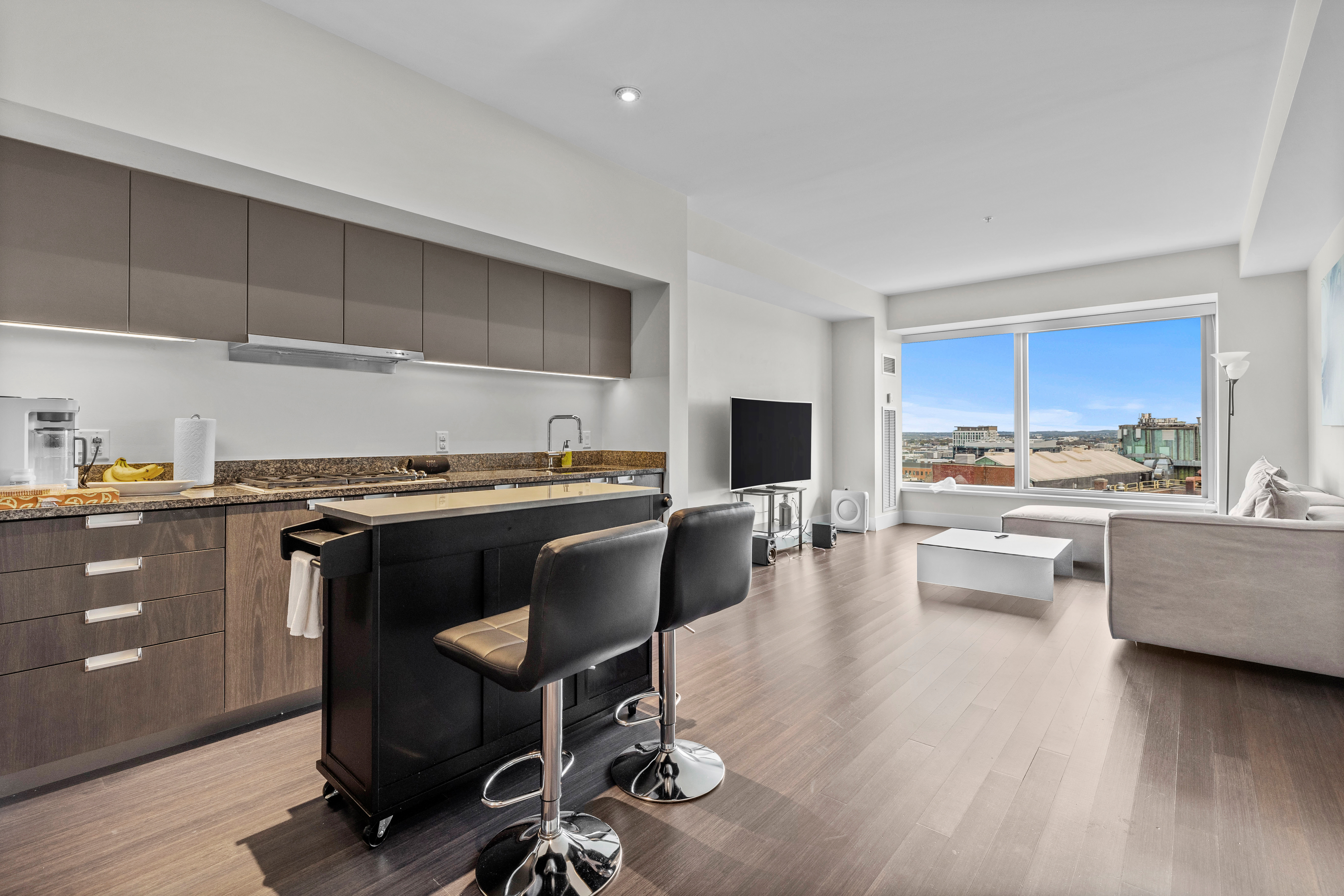 a view of kitchen with dining table and chairs