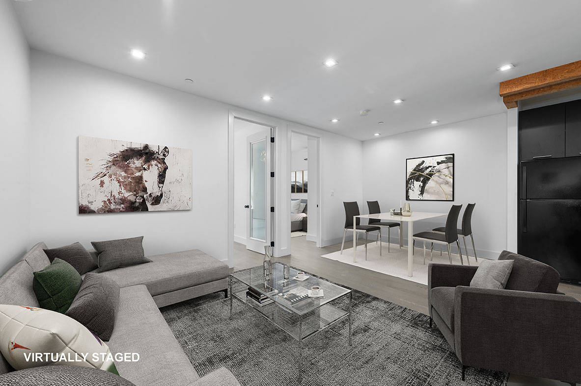 a living room with furniture and a rug