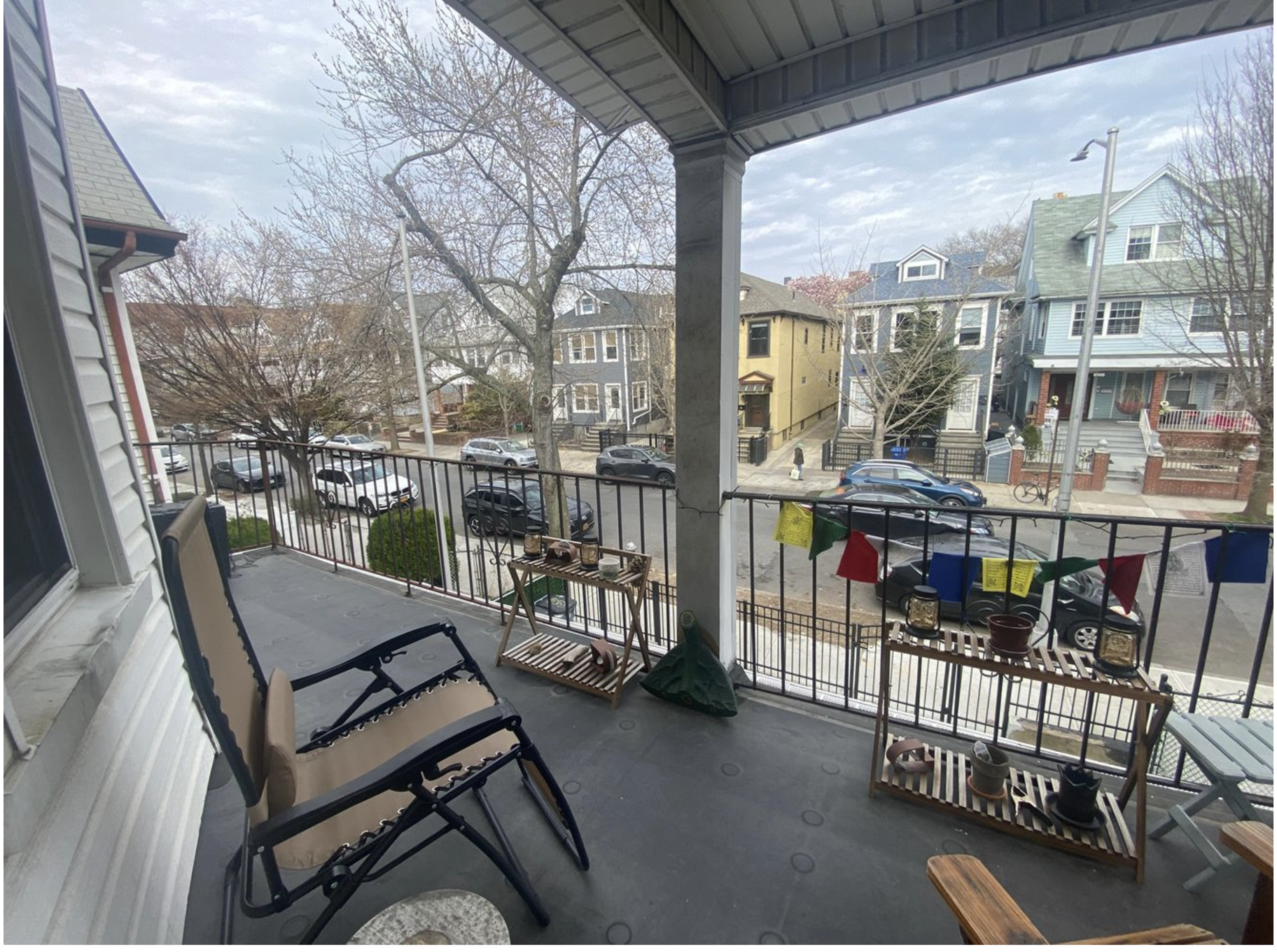 a view of a balcony with chairs